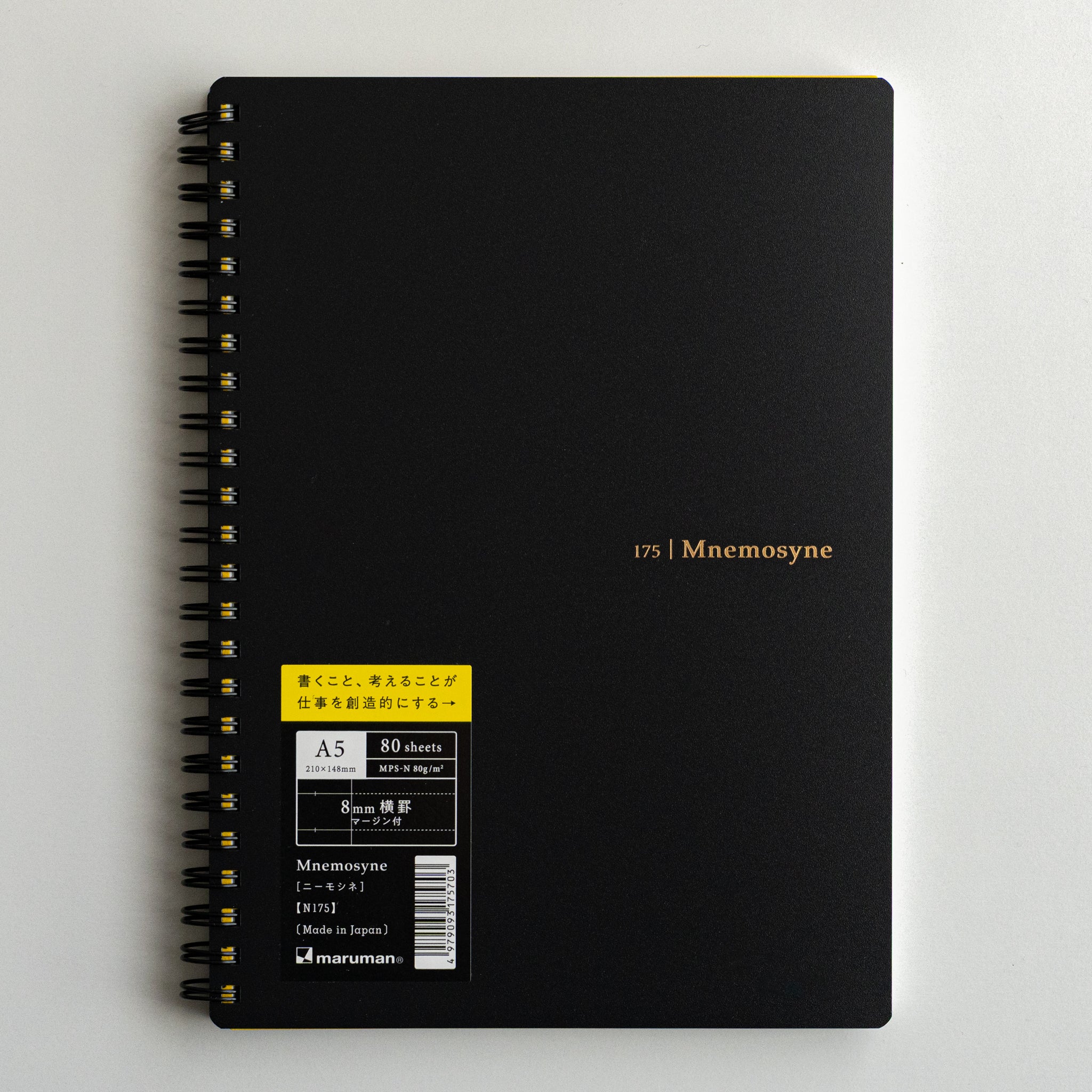 Black Maruman Mnemosyne spiral-bound notebook with gold lettering, elegant Japanese stationery for creativity
