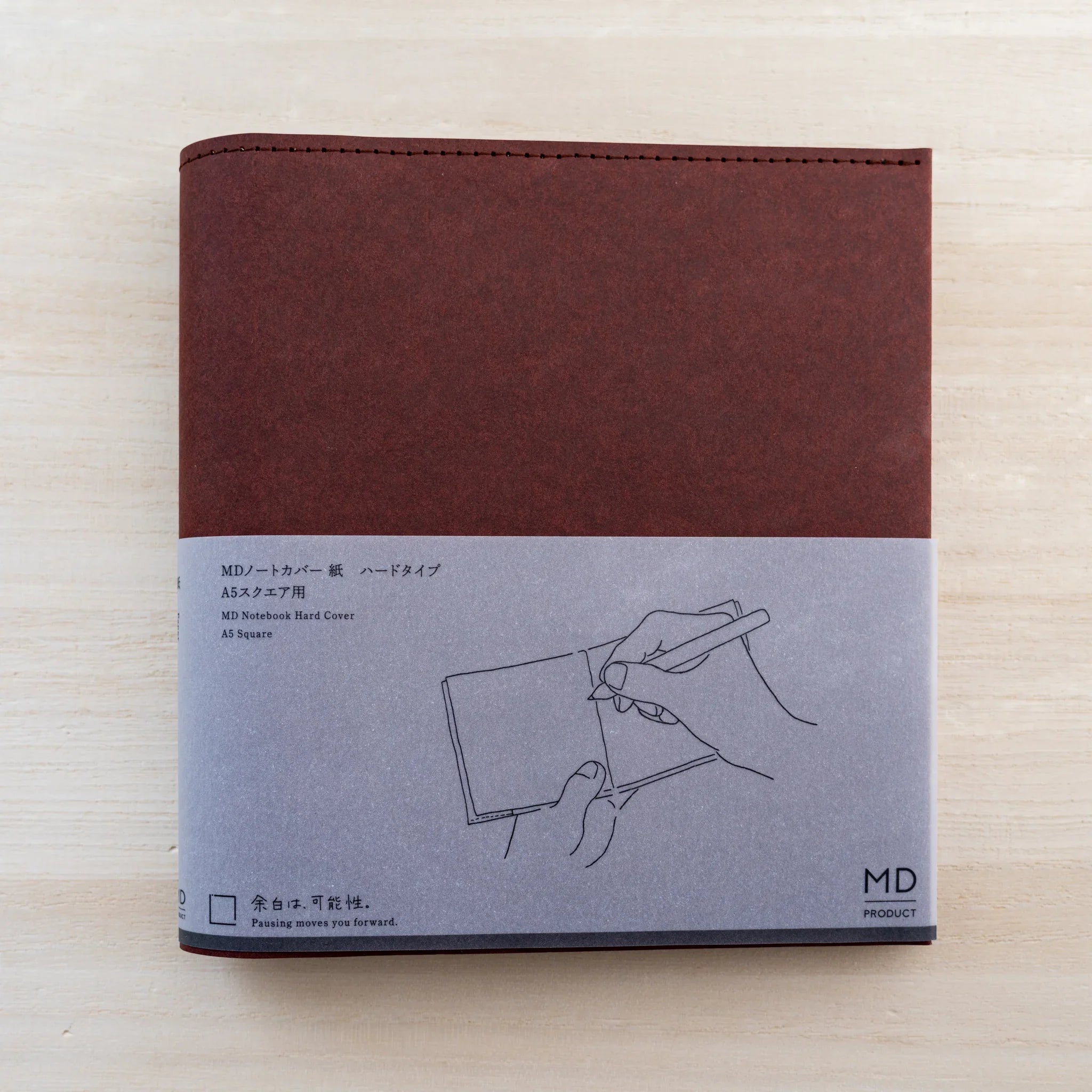 Dark maroon MD Notebook Hard Cover A5 Square in firm paper with grey belly band, front view