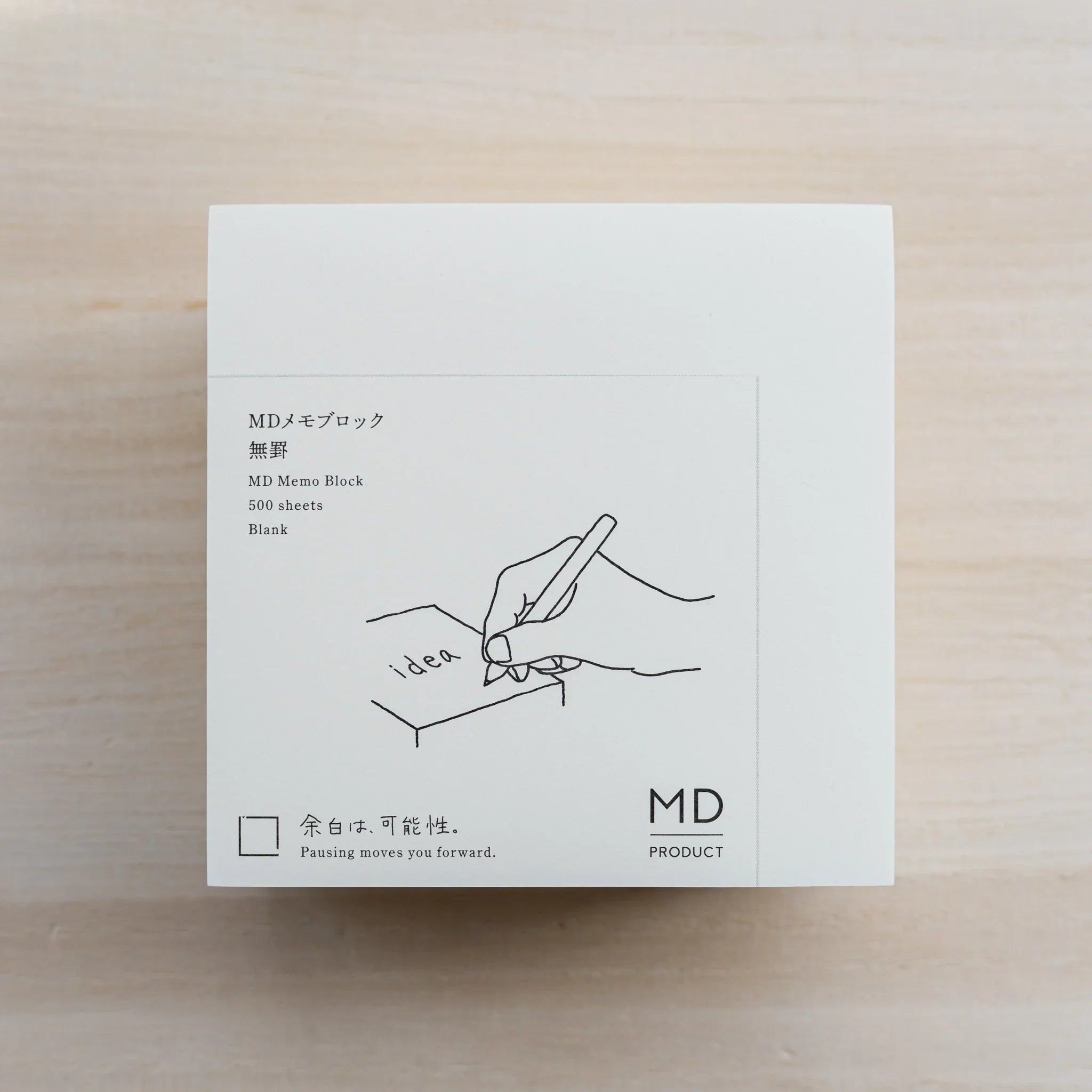 MD Memo Block blank type, white wrap reading MD Memo Block 500 sheets Blank with hand-and-pen illustration