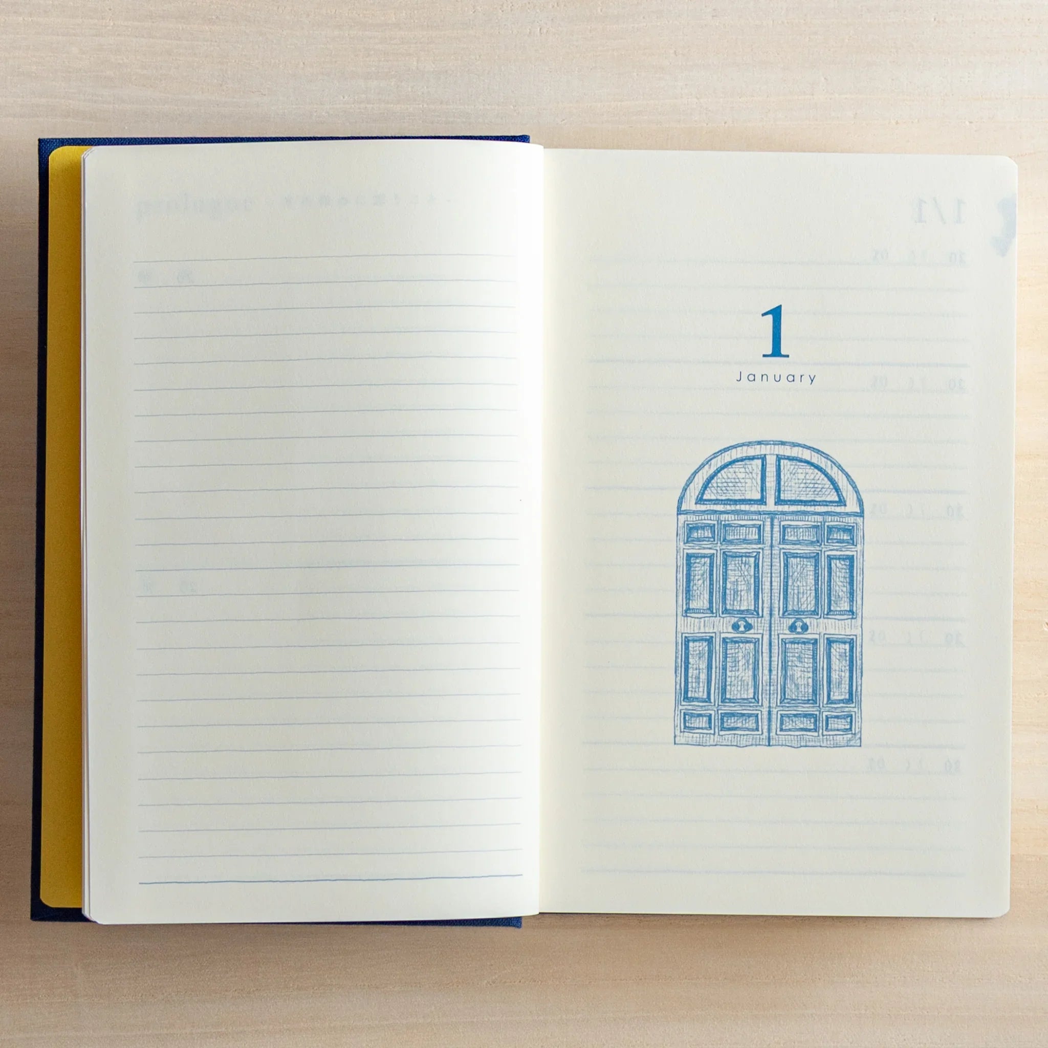 Open Midori Japanese journal 10-year diary gate design with January page and blue door illustration.