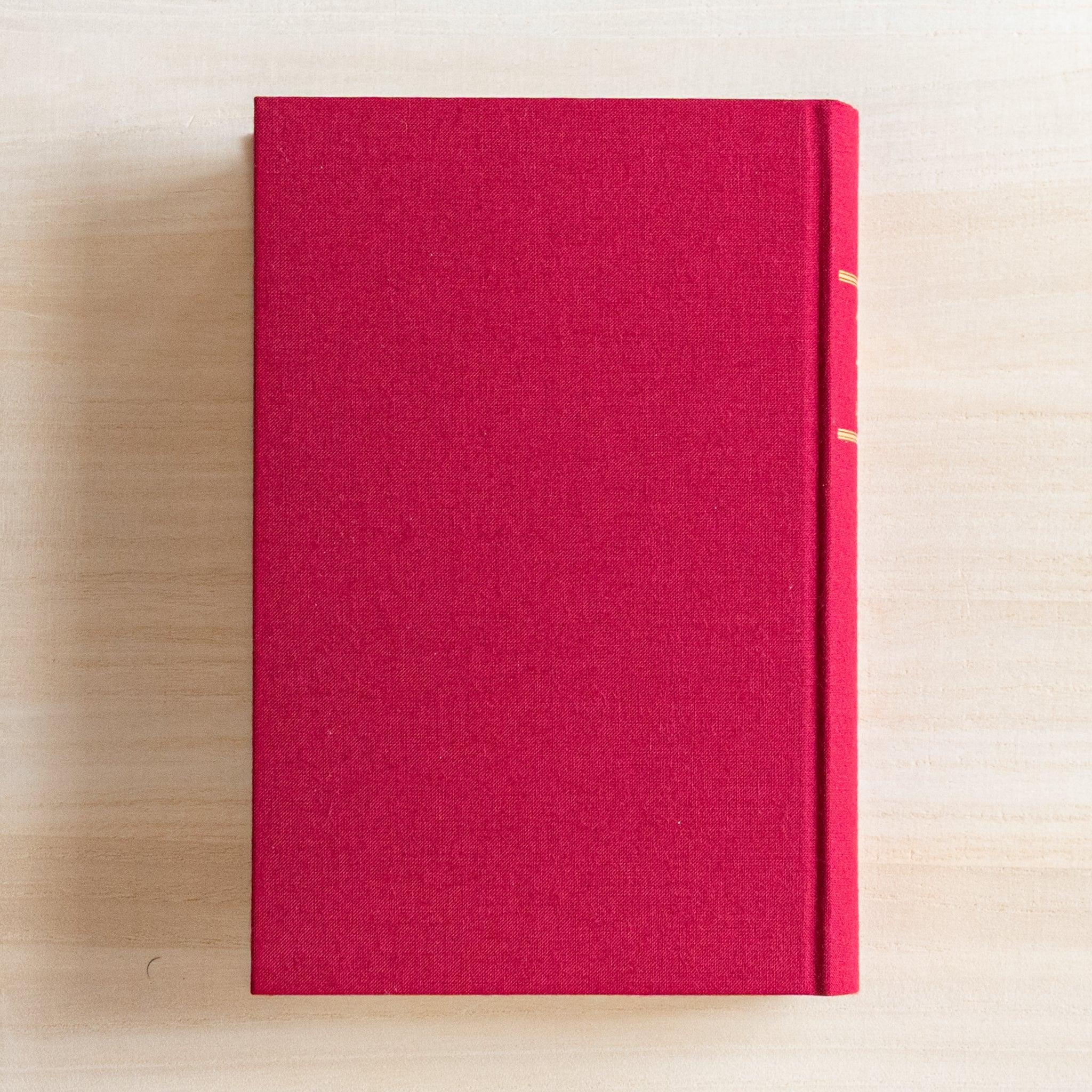 Back cover of Midori Japanese journal 10-year diary gate design showing red cloth cover of the book.