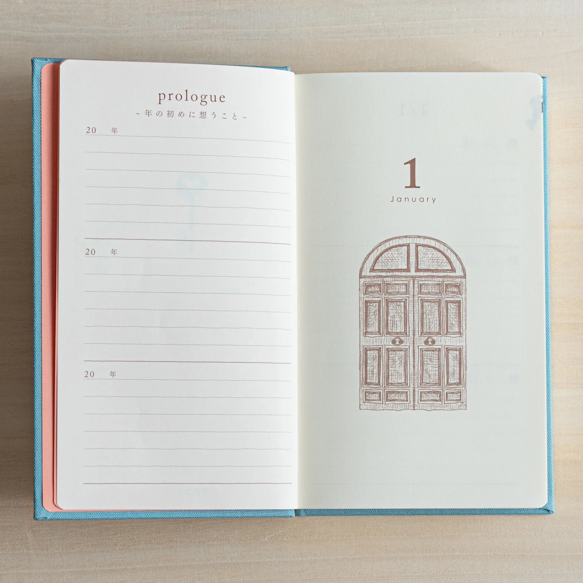 Open Midori Japanese journal 3 Year Diary Gate Design showing January page with brown door illustration.