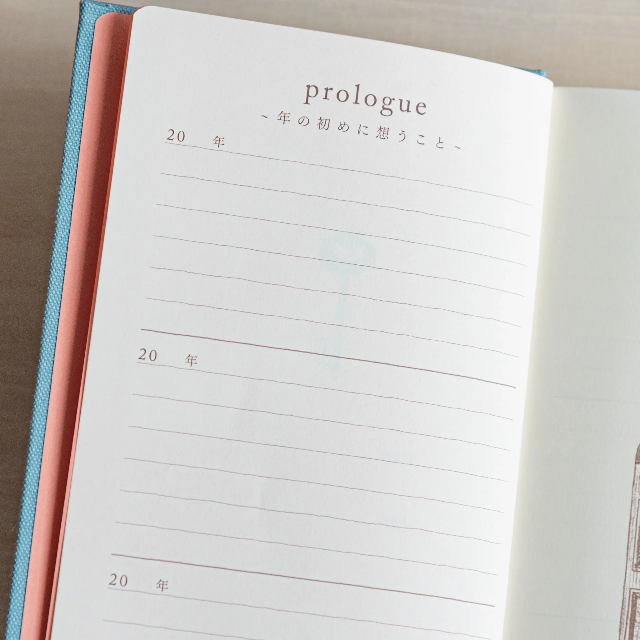 Open Midori Japanese journal 3 Year Diary Gate Design showing prologue page with pink endpaper and lined section.