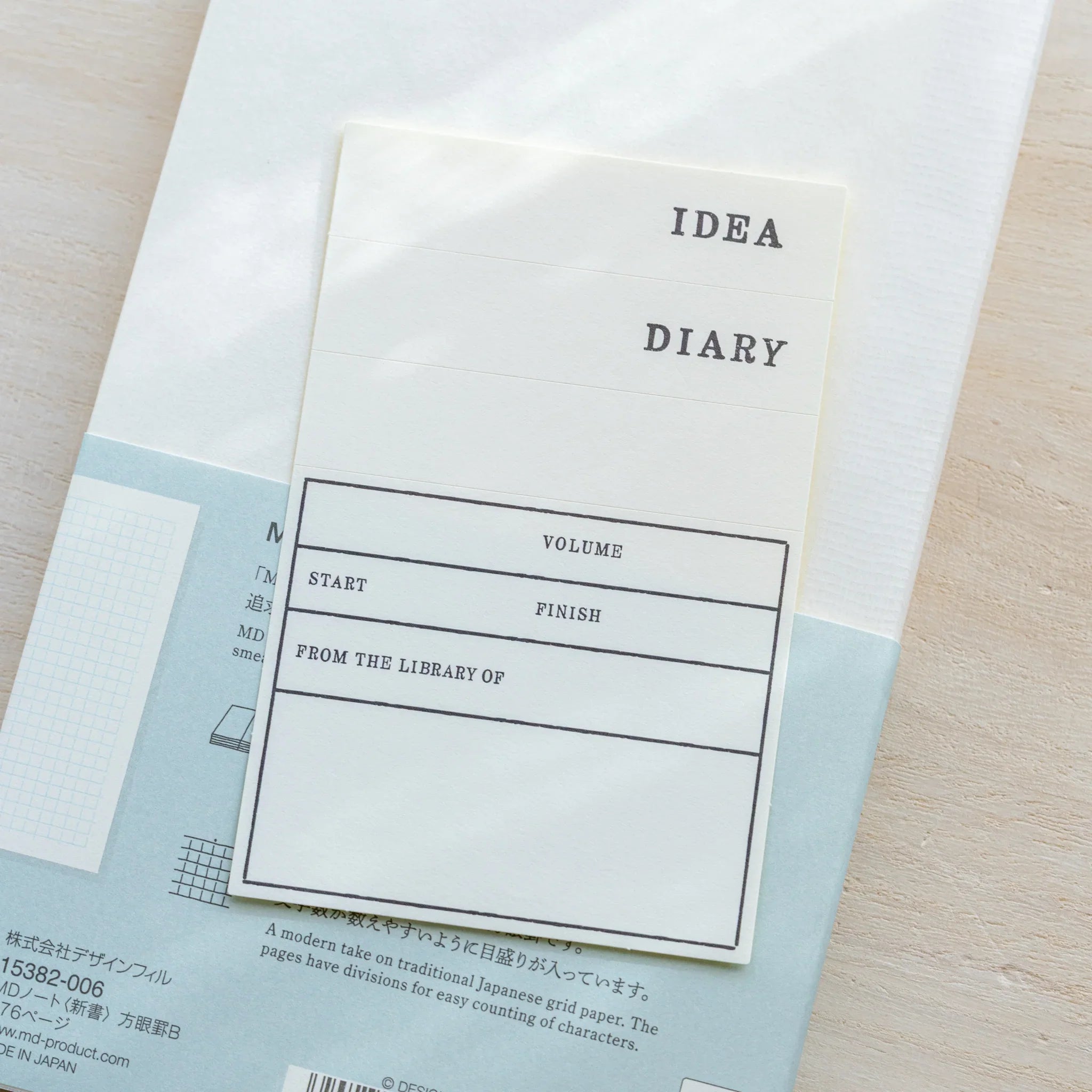 Midori MD Notebook B6 Slim Grid title page with IDEA DIARY header and fill-in fields, back cover with product info visible