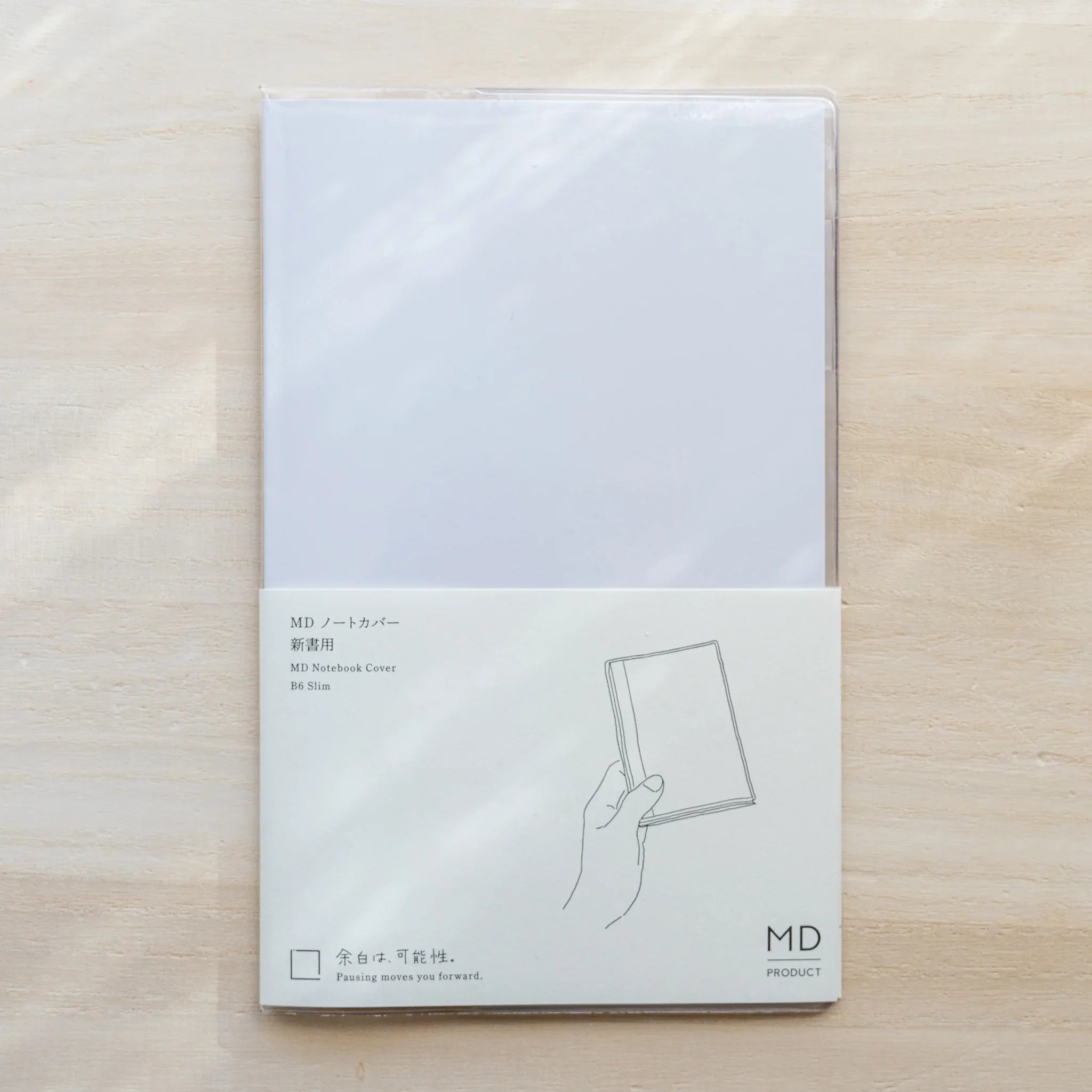MD Notebook Cover B6 Slim in packaging, clear PVC with cream insert card and slim notebook illustration