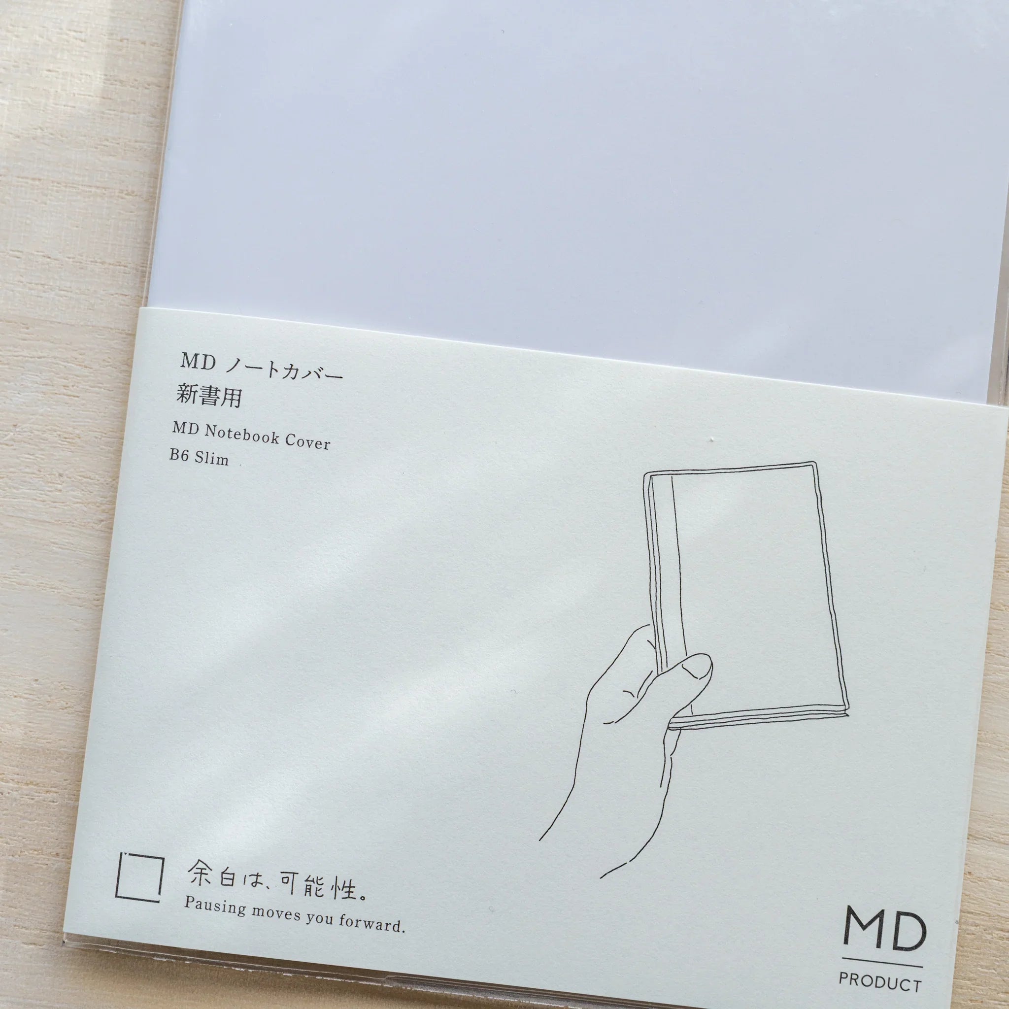 MD Notebook Cover B6 Slim insert card close-up with Japanese and English label, slim notebook illustration and MD PRODUCT logo
