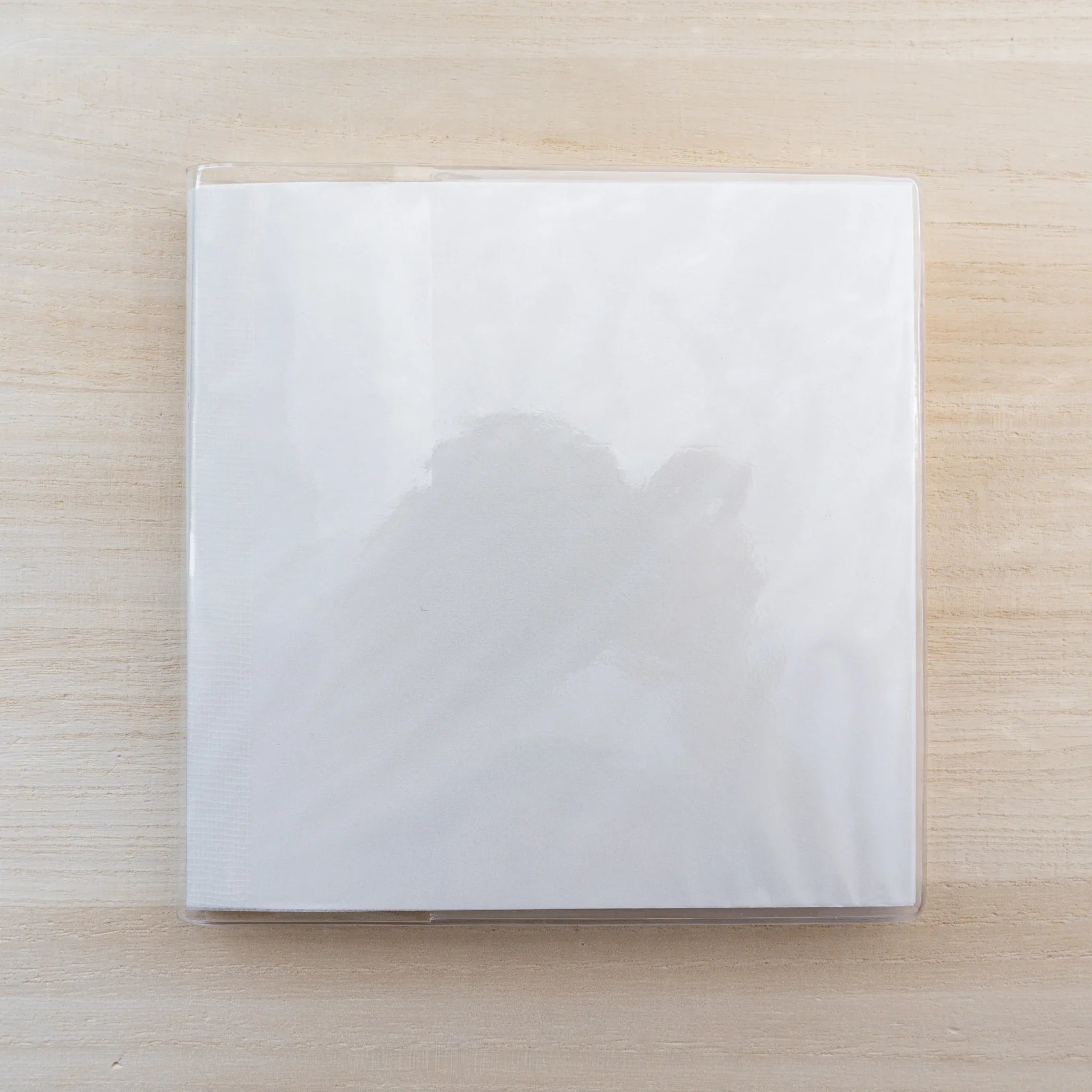 Square white MD notebook inside clear PVC Midori MD Notebook Cover A5 Square, front view