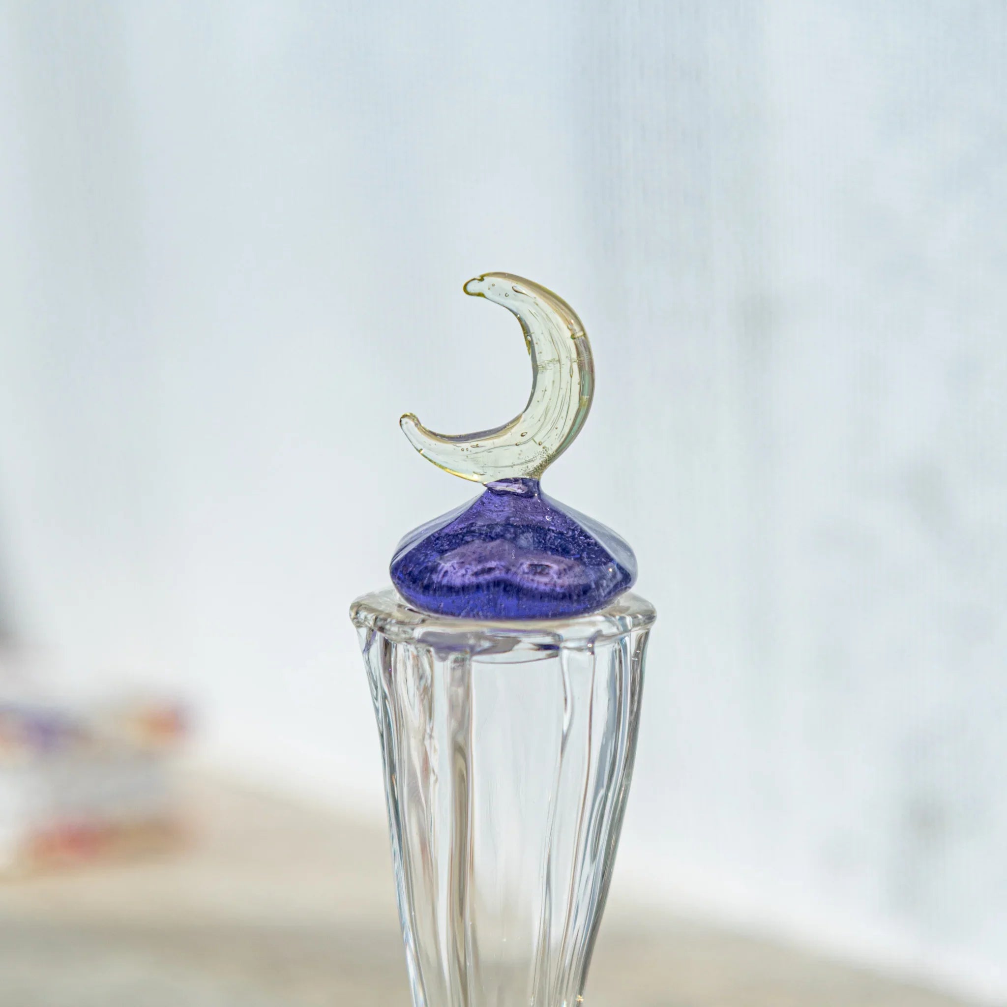 Handcrafted Moonlit Glass Ink Well, a Japanese glass ink well featuring a delicate crescent moon lid and sparkling violet base.