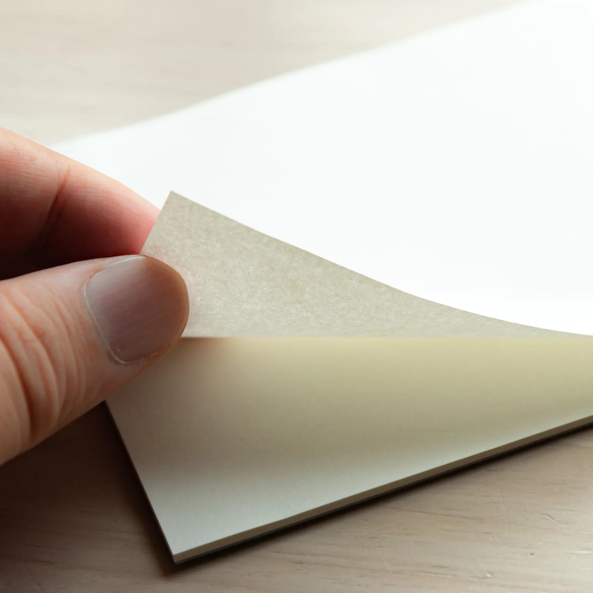 Hand flipping a sheet of Japanese Paper Planner A4, 52gsm, thin smooth fountain pen paper. 