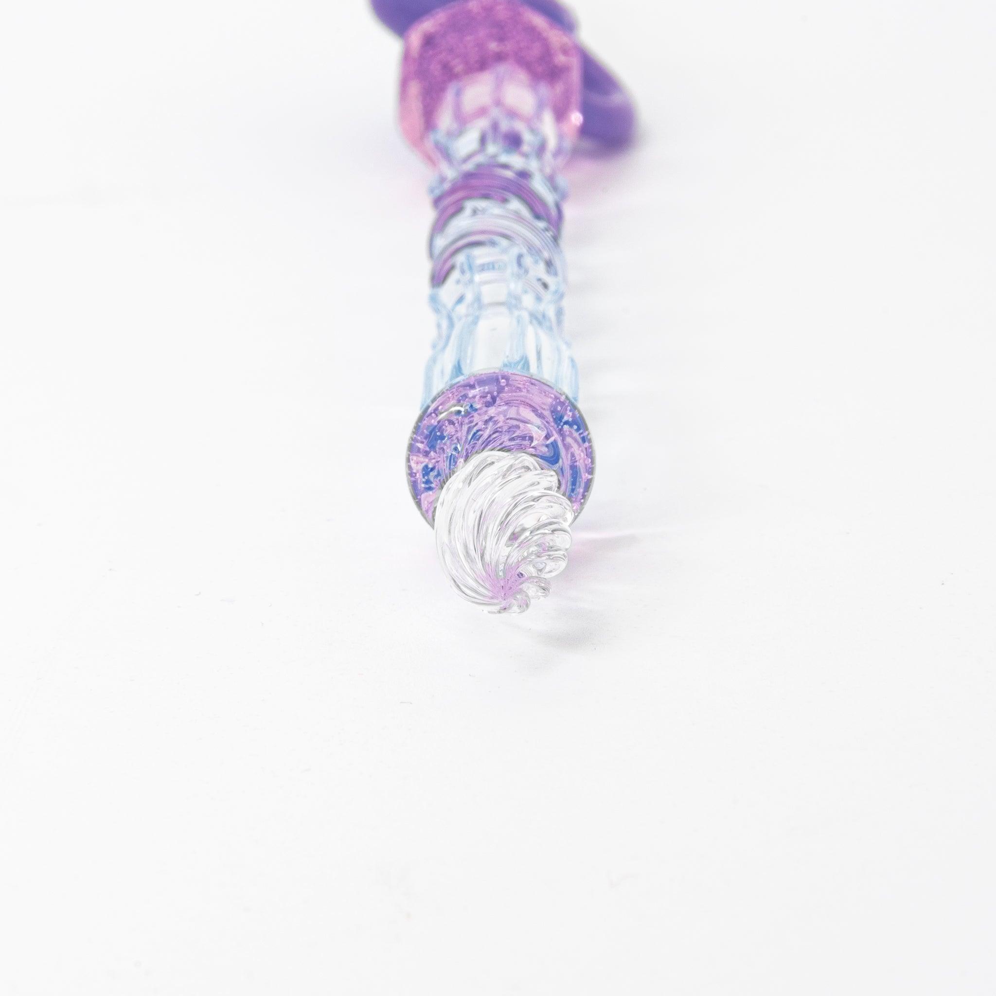 Glass pen with a blue shaft, purple cat topper, and pink charm. Includes matching purple pen rest. Perfect for Japanese stationery lovers.