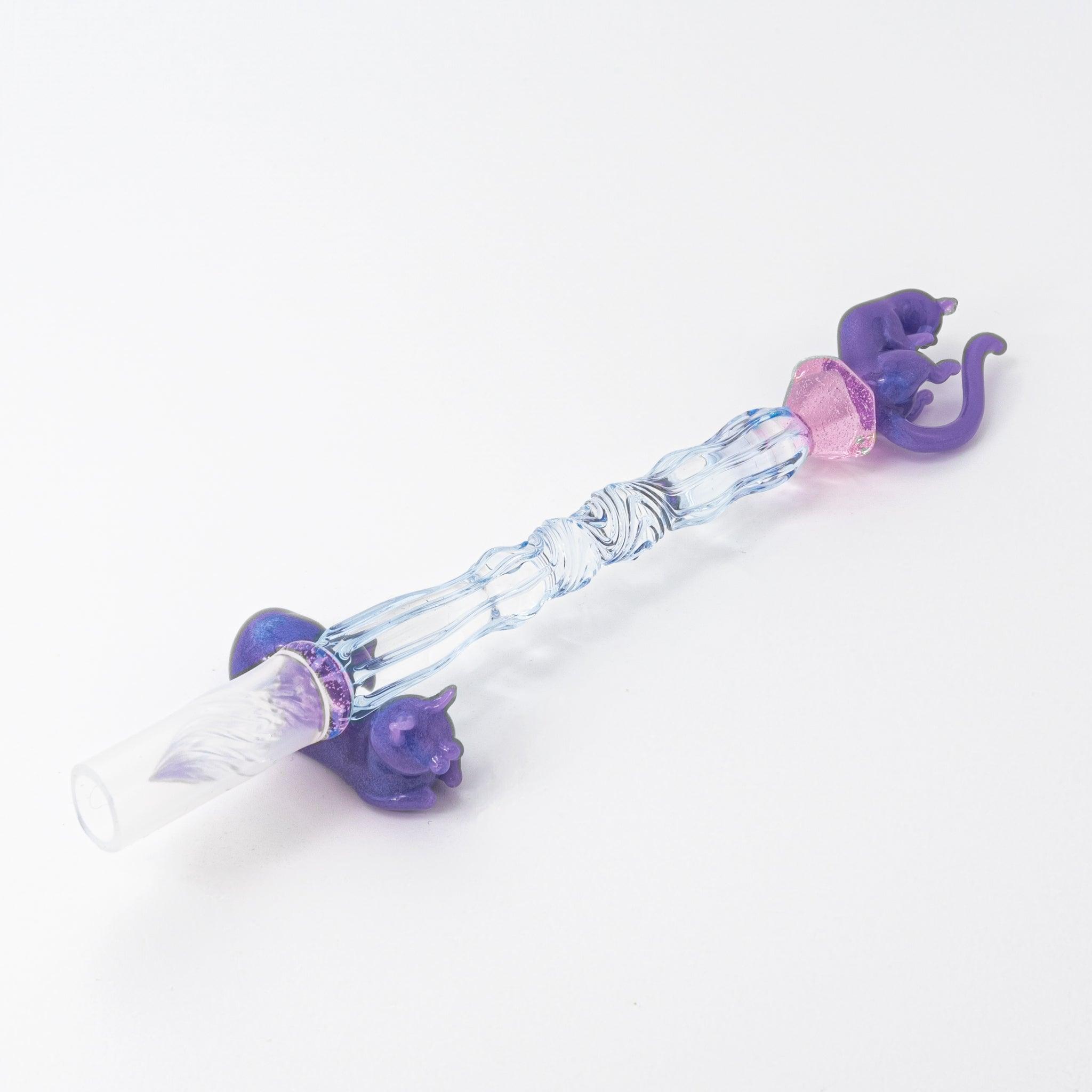 Glass pen with a blue shaft, purple cat topper, and pink charm. Includes matching purple pen rest. Perfect for Japanese stationery lovers.