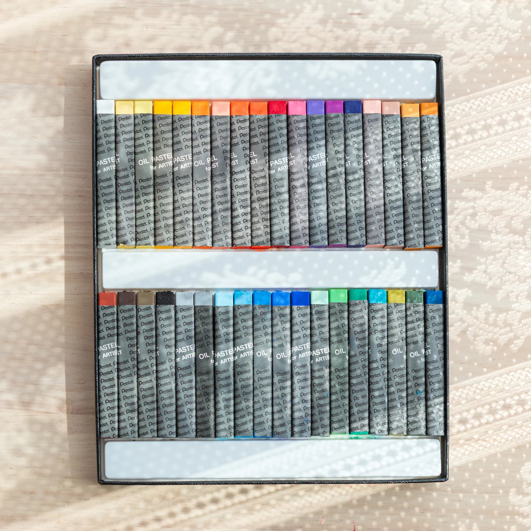 Open Pentel Japanese Oil Pastel set with 36 vibrant colors neatly arranged for arts and crafts or illustration projects.