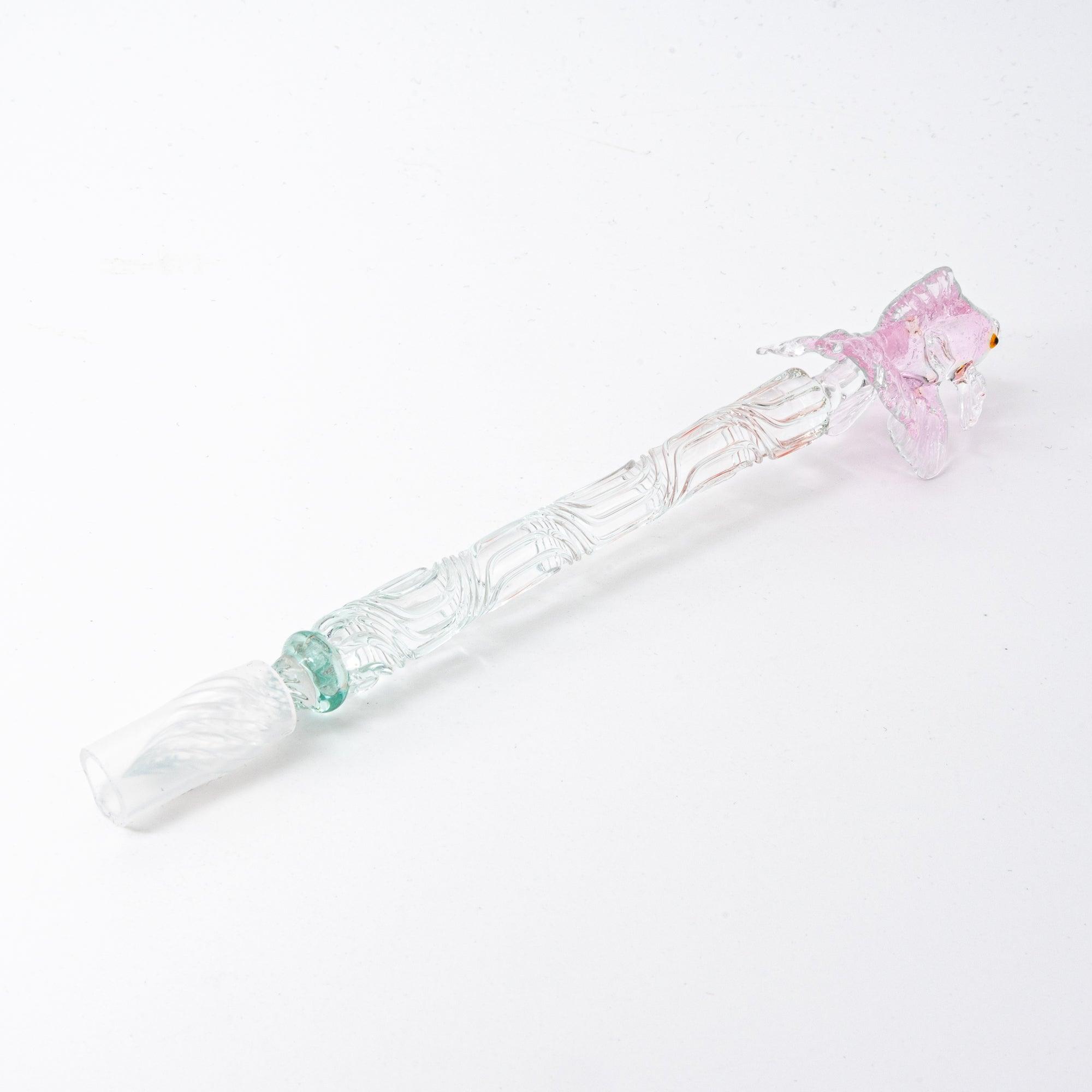 The pink goldfish glass pen photographed on a white background, displaying the clear glass body and the intricately sculpted goldfish in pink glass at the top.