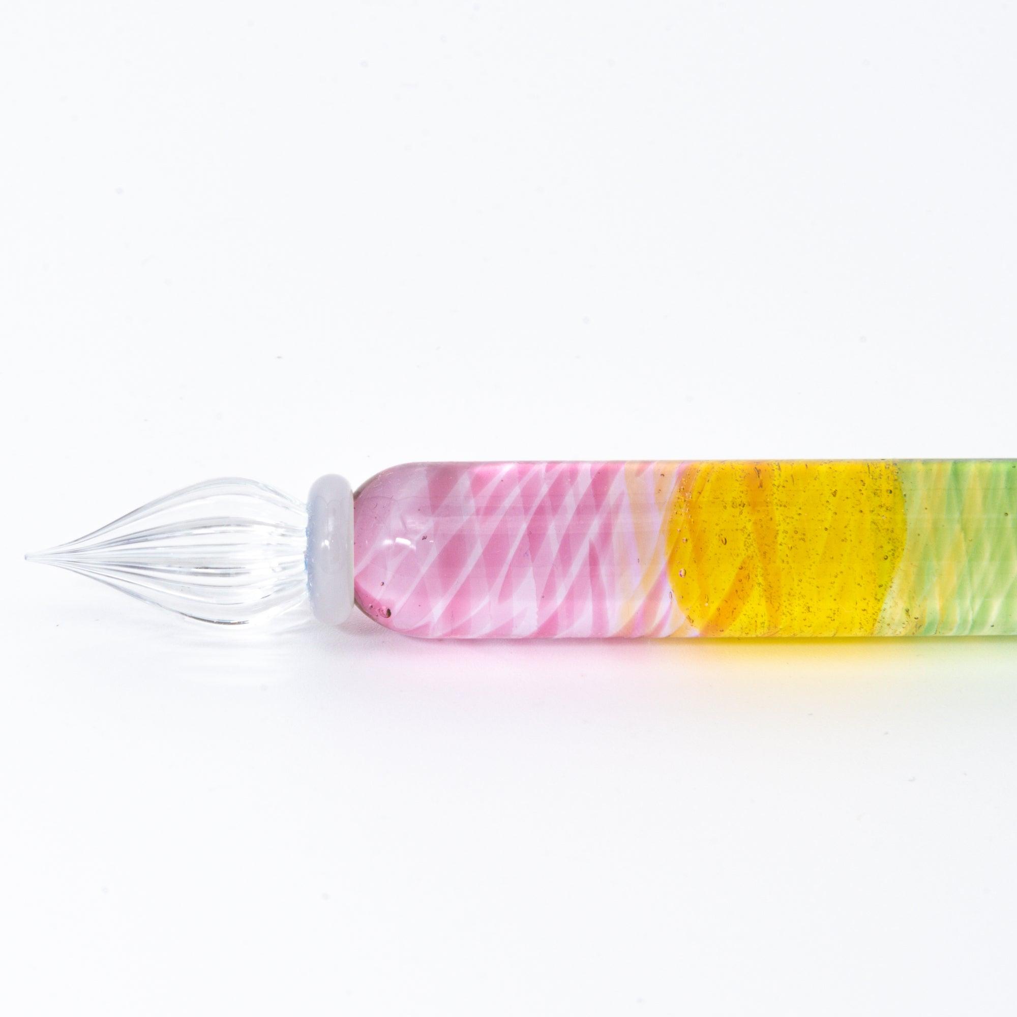 Short glass dip pen with vibrant rainbow colors and a spiral design, perfect for Japanese stationery enthusiasts, displayed on a clean white background.