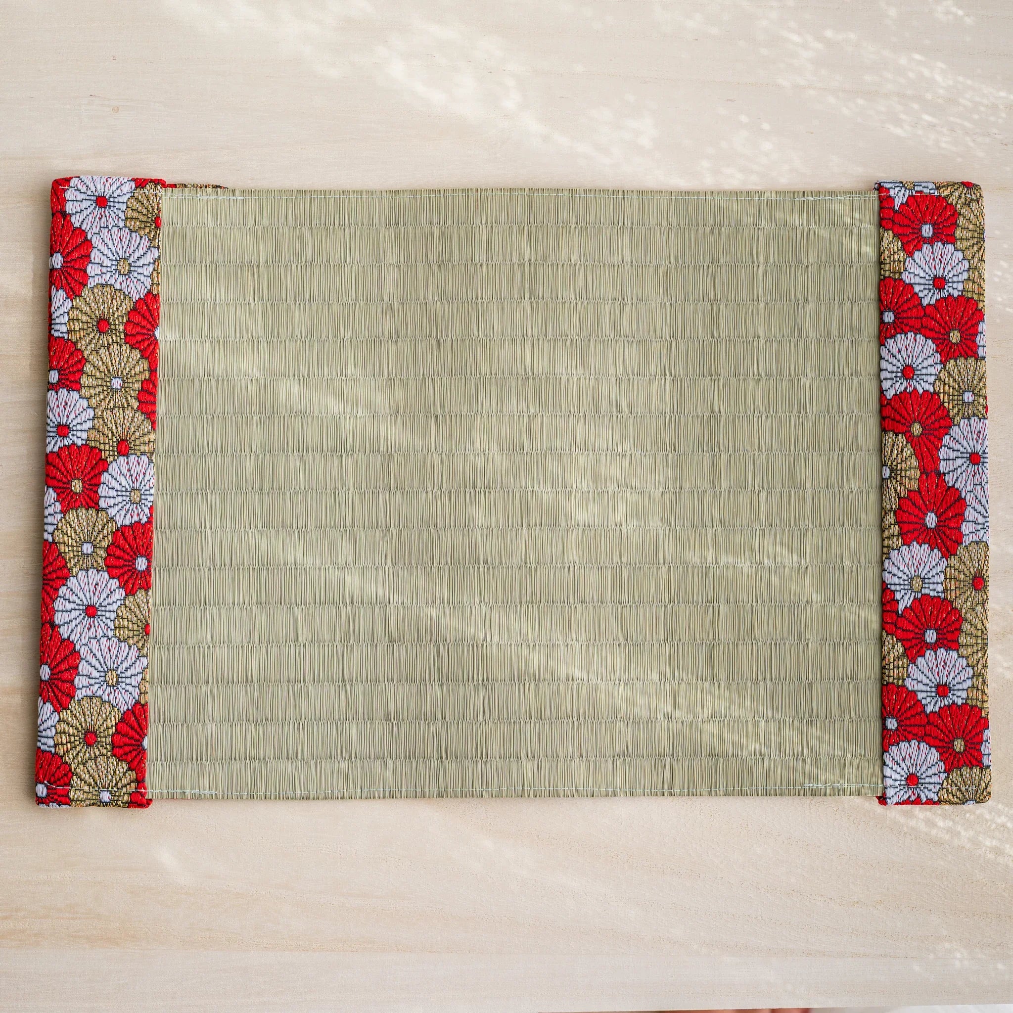 Red Imperial Chrysanthemum tatami book cover unfolded flat, outer side up, rush straw with chrysanthemum flaps