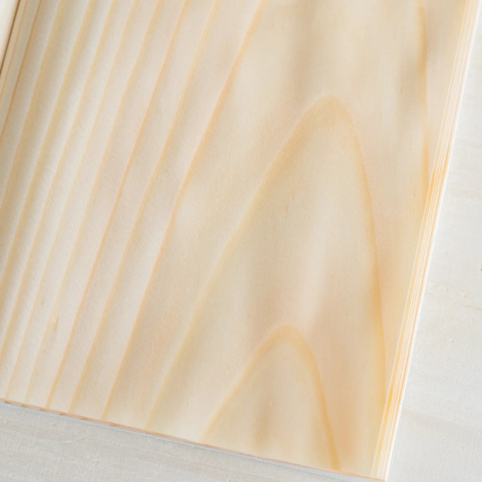 Red Pine wooden page B6, angled spine view of binding and wood integration with natural grain showing natural wood material