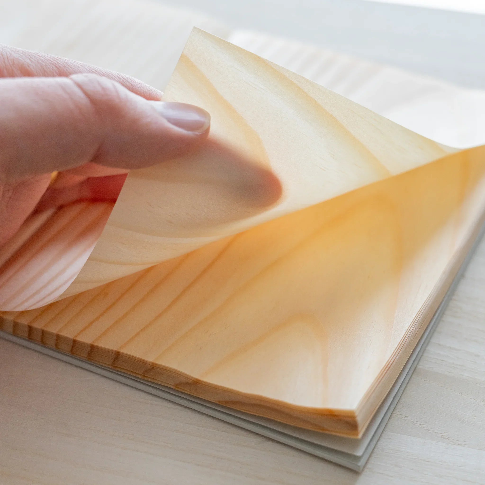 Red Pine wood-paged B6 notebook, individual pages showing natural wood grain and binding features showing natural wood