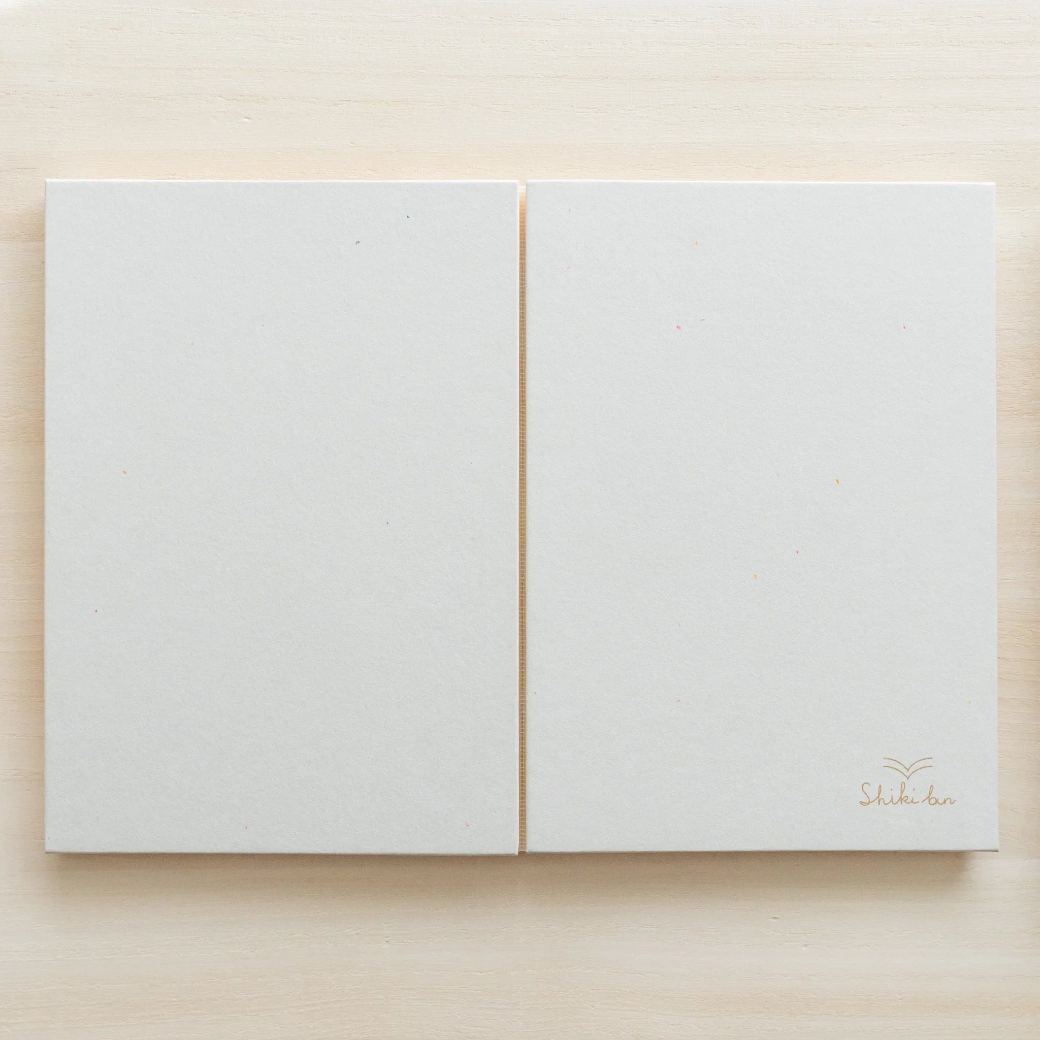 Natural red pine B6 journal, detail shot of wooden page attachment and craftsmanship quality showing natural wood material