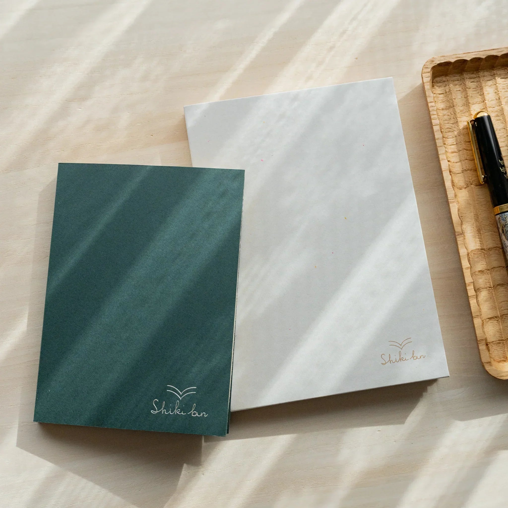 Red Pine B6 wooden page notebook, fully opened center spread showing page design and grain detail showing natural wood