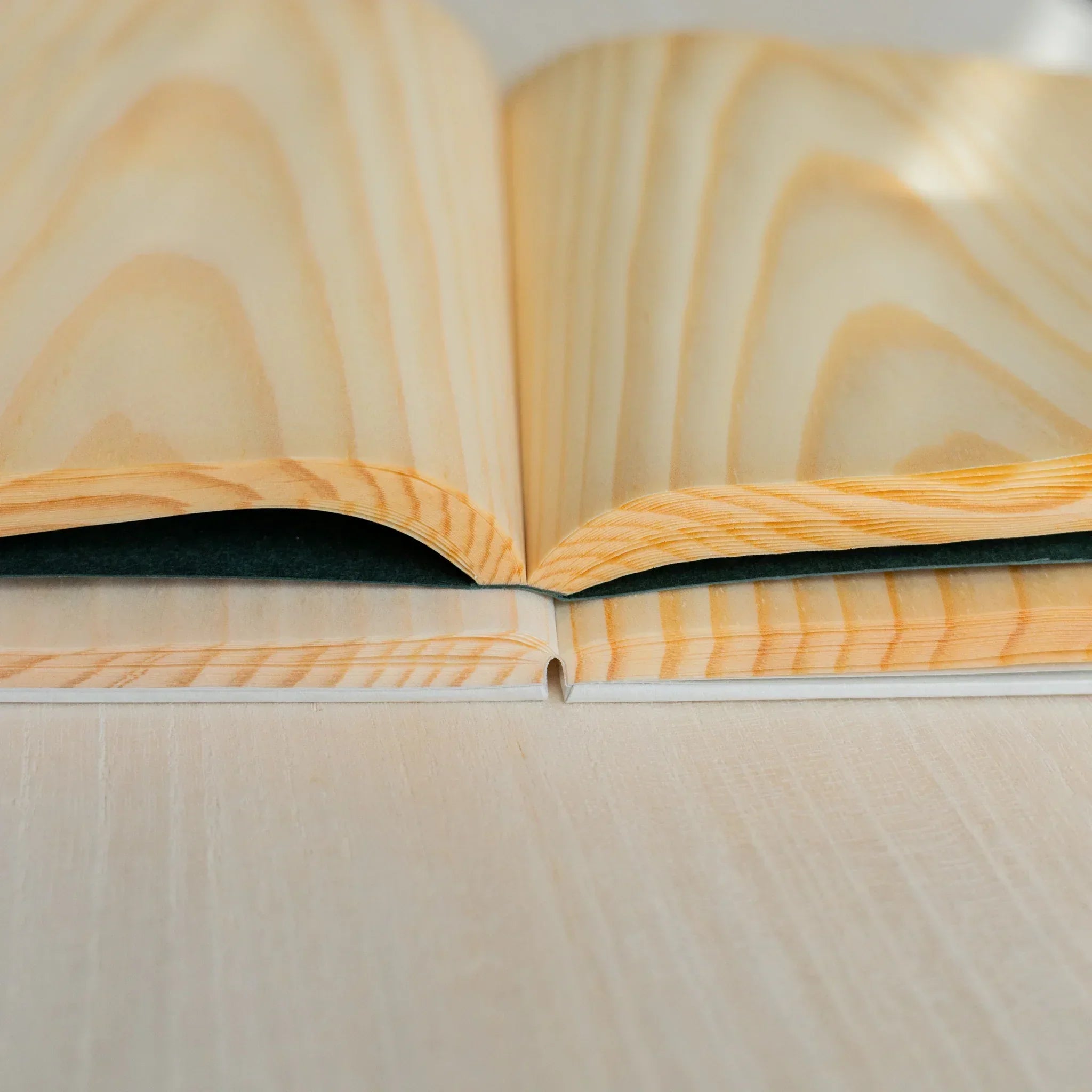 Natural wood red pine B6 journal, corner detail of binding and wooden page craftsmanship quality showing natural wood