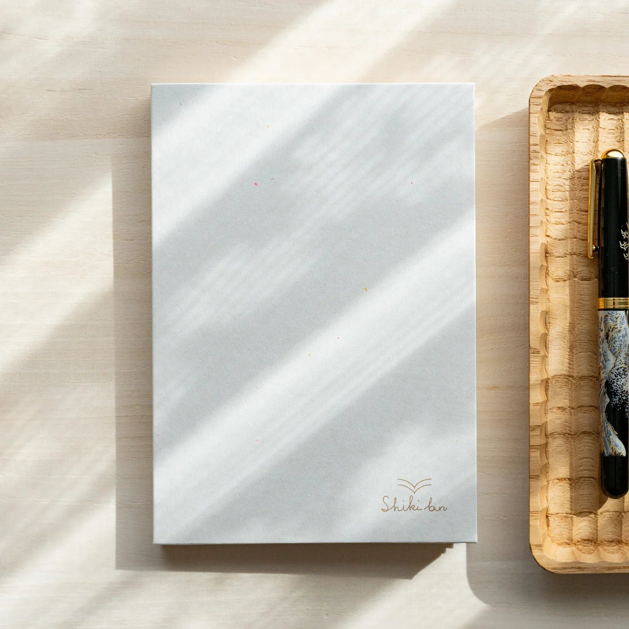 Japanese red pine wooden B6 journal, angled product with natural wood texture and binding craftsmanship