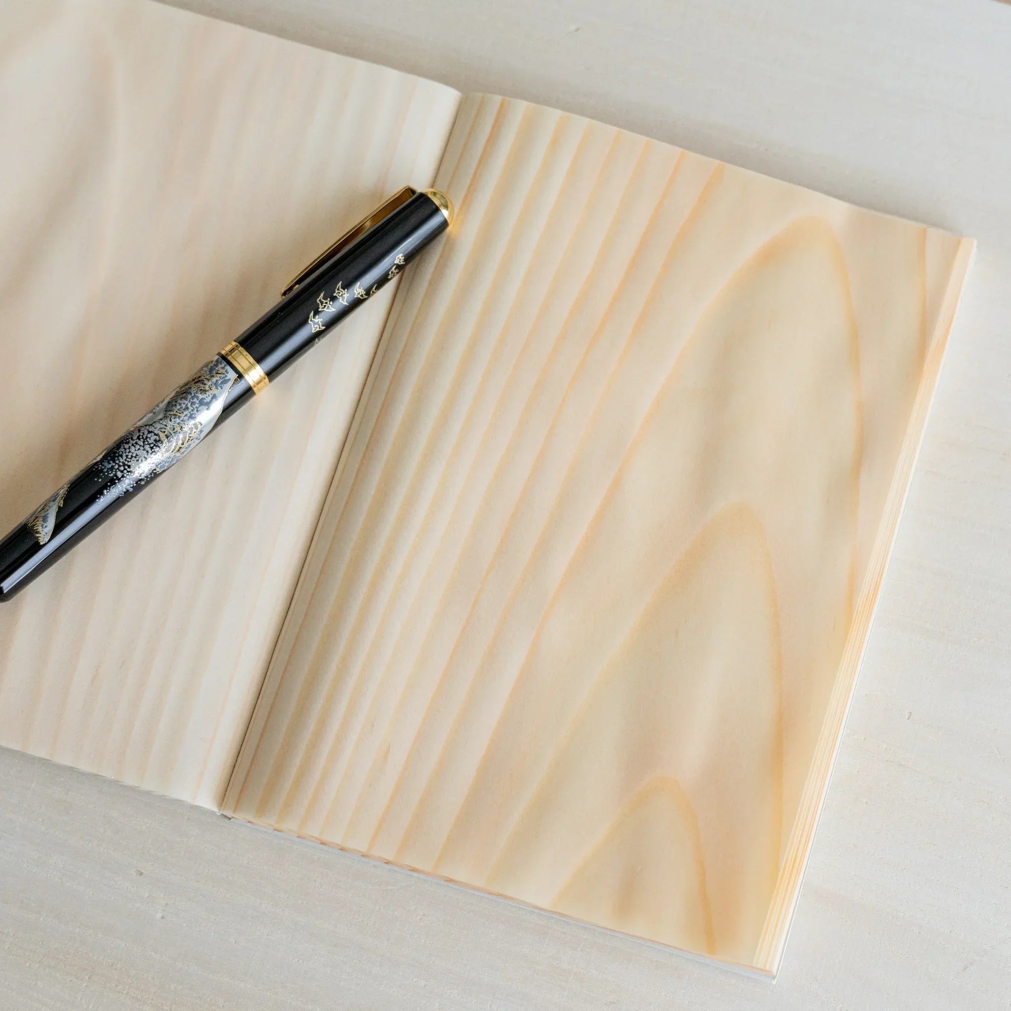 Red Pine B6 journal with wooden pages, fully opened display of handmade wooden page elements showing natural wood material