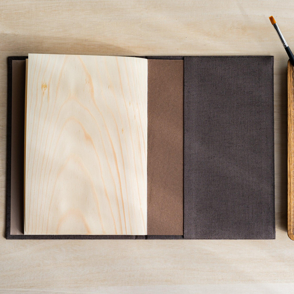 Red Pine Wooden Page Sketchbook Brown with wood pages folded back, brown backing board and cloth cover visible