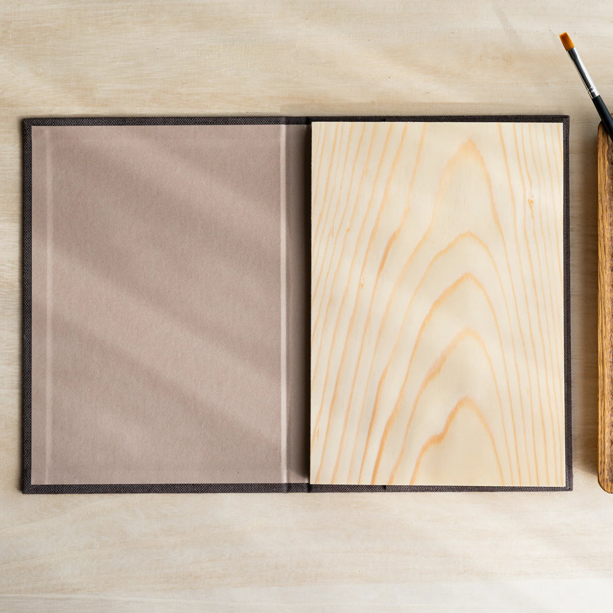 Red Pine Wooden Page Sketchbook Brown open, taupe inside cover on left, blank wood sheet page with grain on right