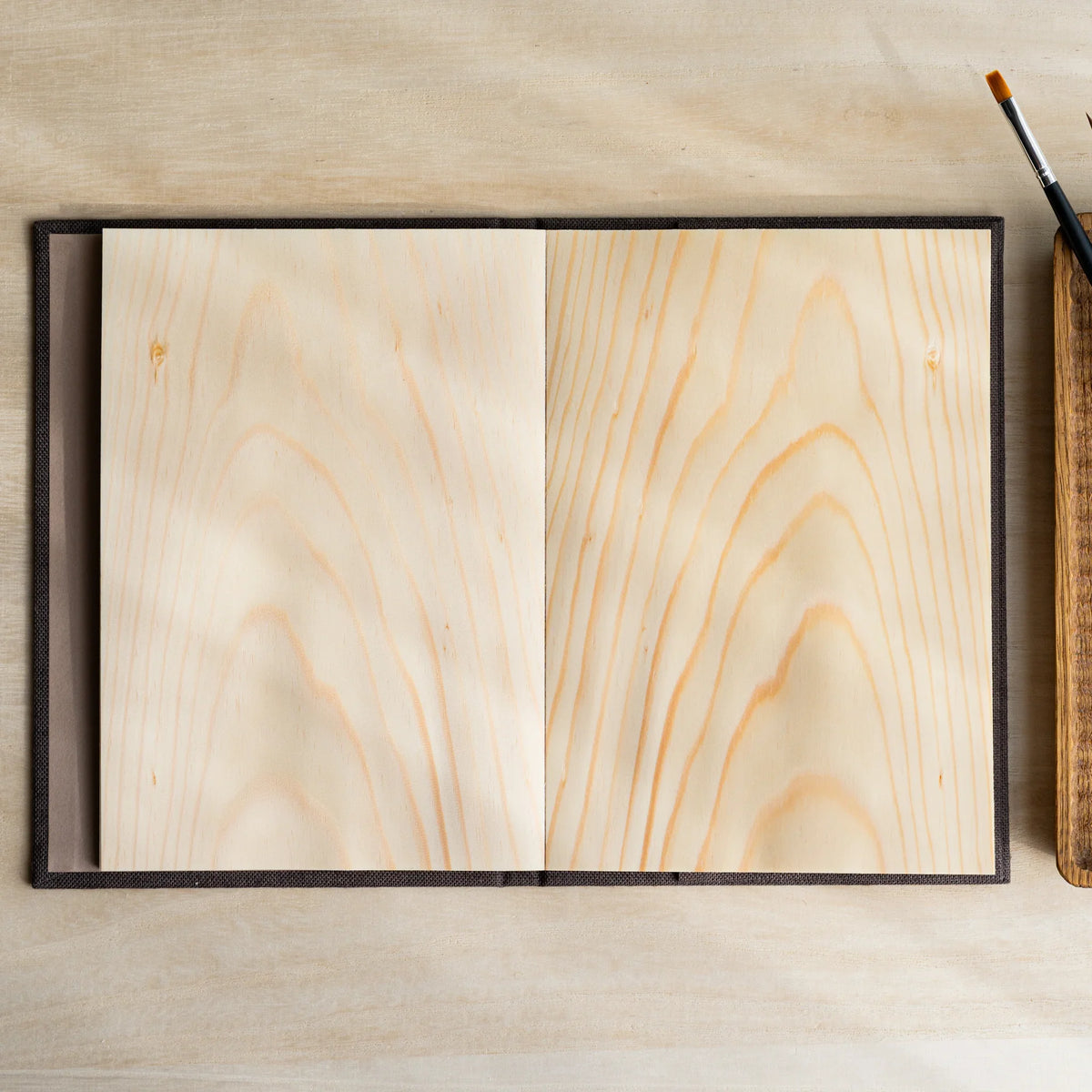 Red Pine Wooden Page Sketchbook Brown open to a spread of two blank wood sheet pages with visible grain