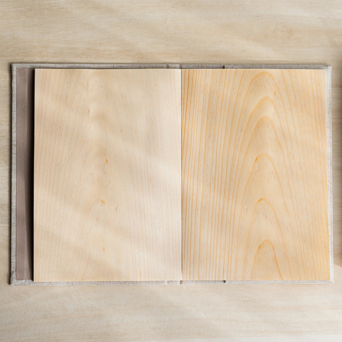 Red Pine Wooden Page Sketchbook Natural open to a spread of two blank wood sheet pages with visible grain