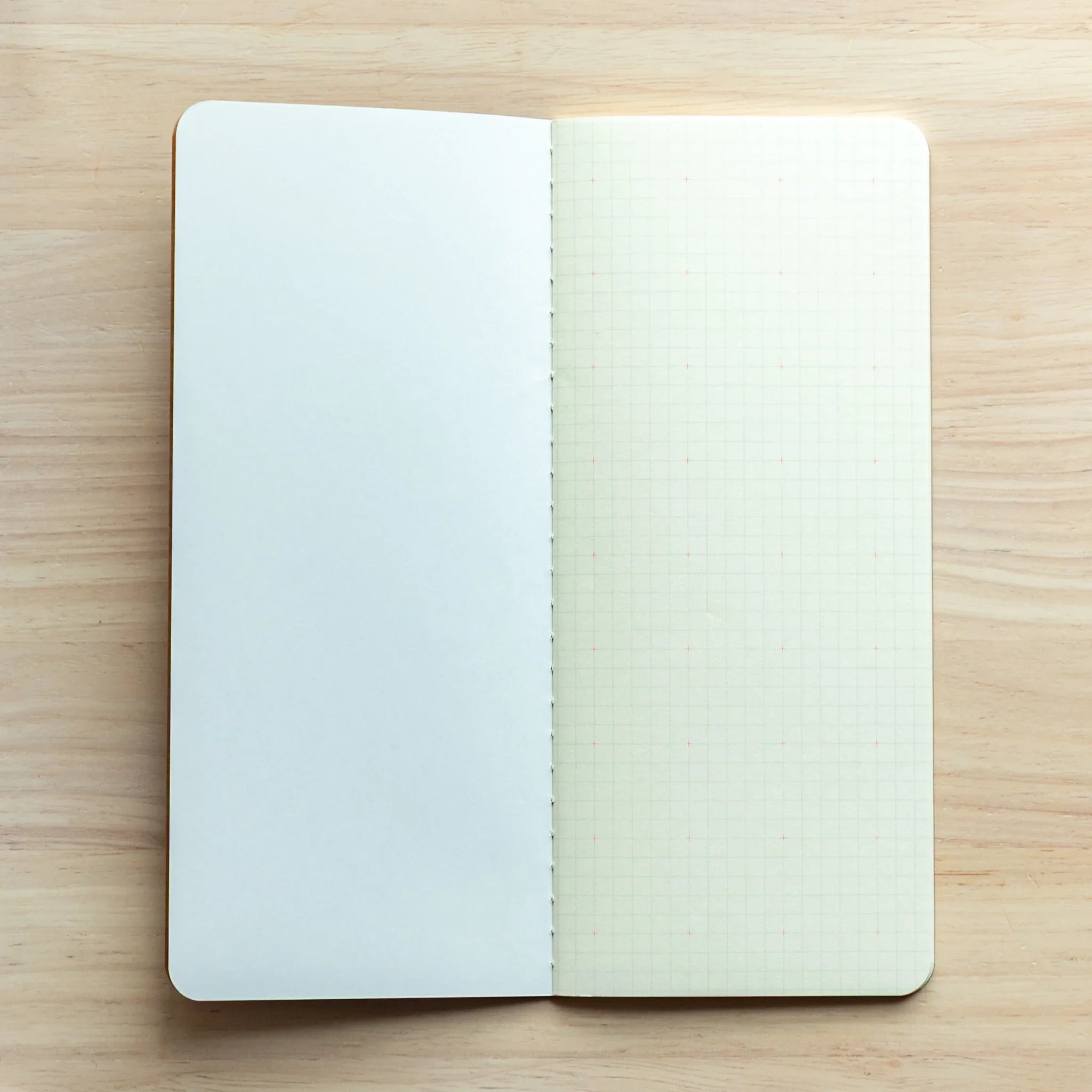 Top-down view of light brown Japanese Notebook, compact size with grid layout for Japanese Fountain Pen.