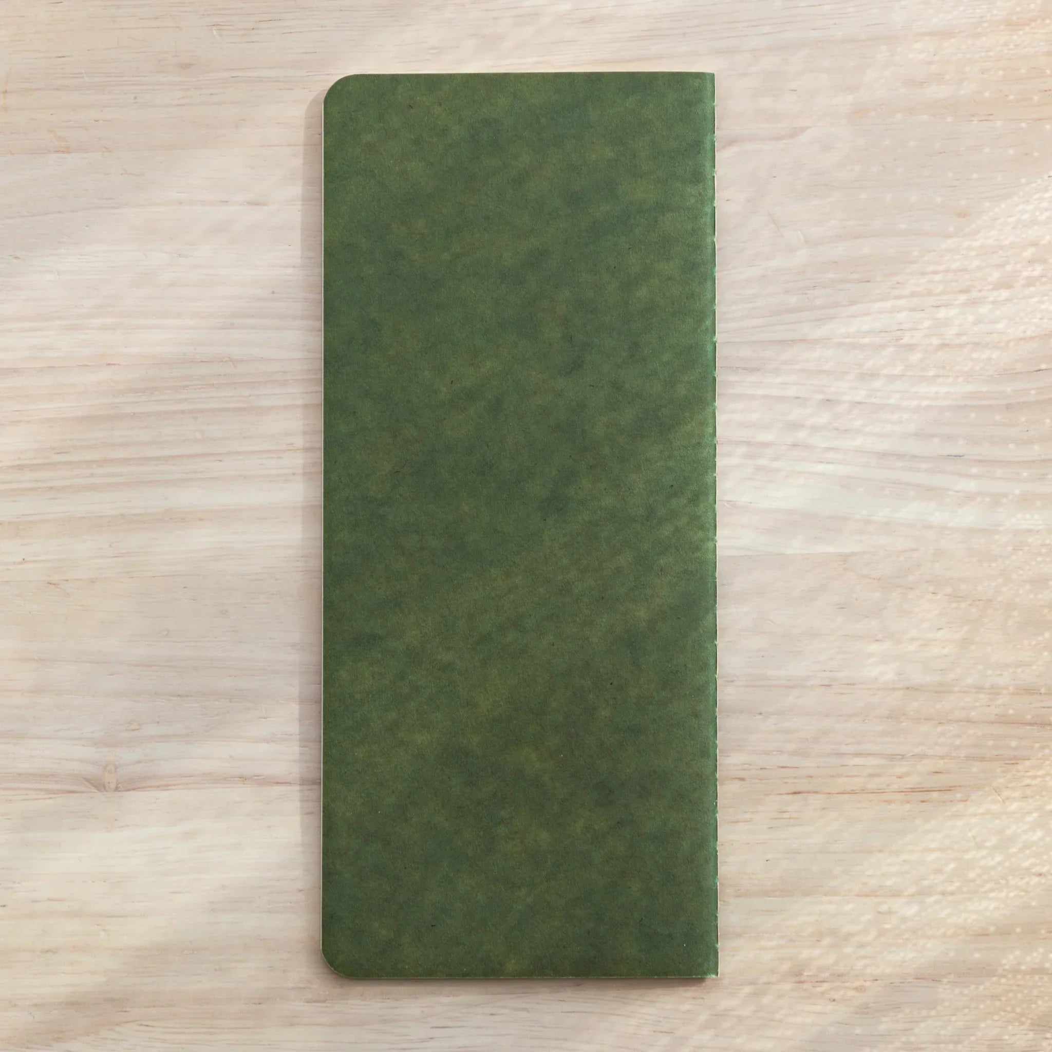 Japanese Notebook RO-BIKI Basic with green cover, shown from back angle to emphasize slim compact profile.