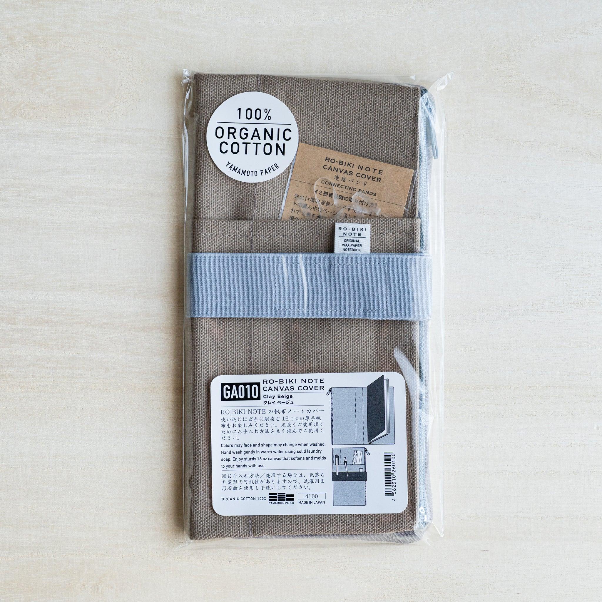 RO-BIKI canvas cover in clay beige in a clear pack with a 100 percent organic cotton sticker and GA010 label