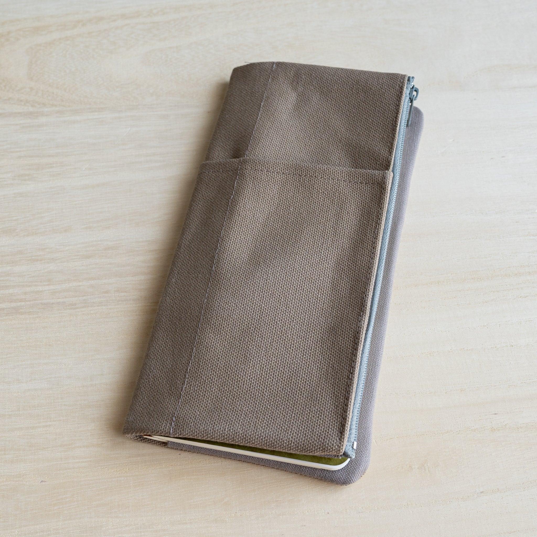 RO-BIKI clay beige canvas cover closed, front view showing two stacked slip pockets for pens and tools