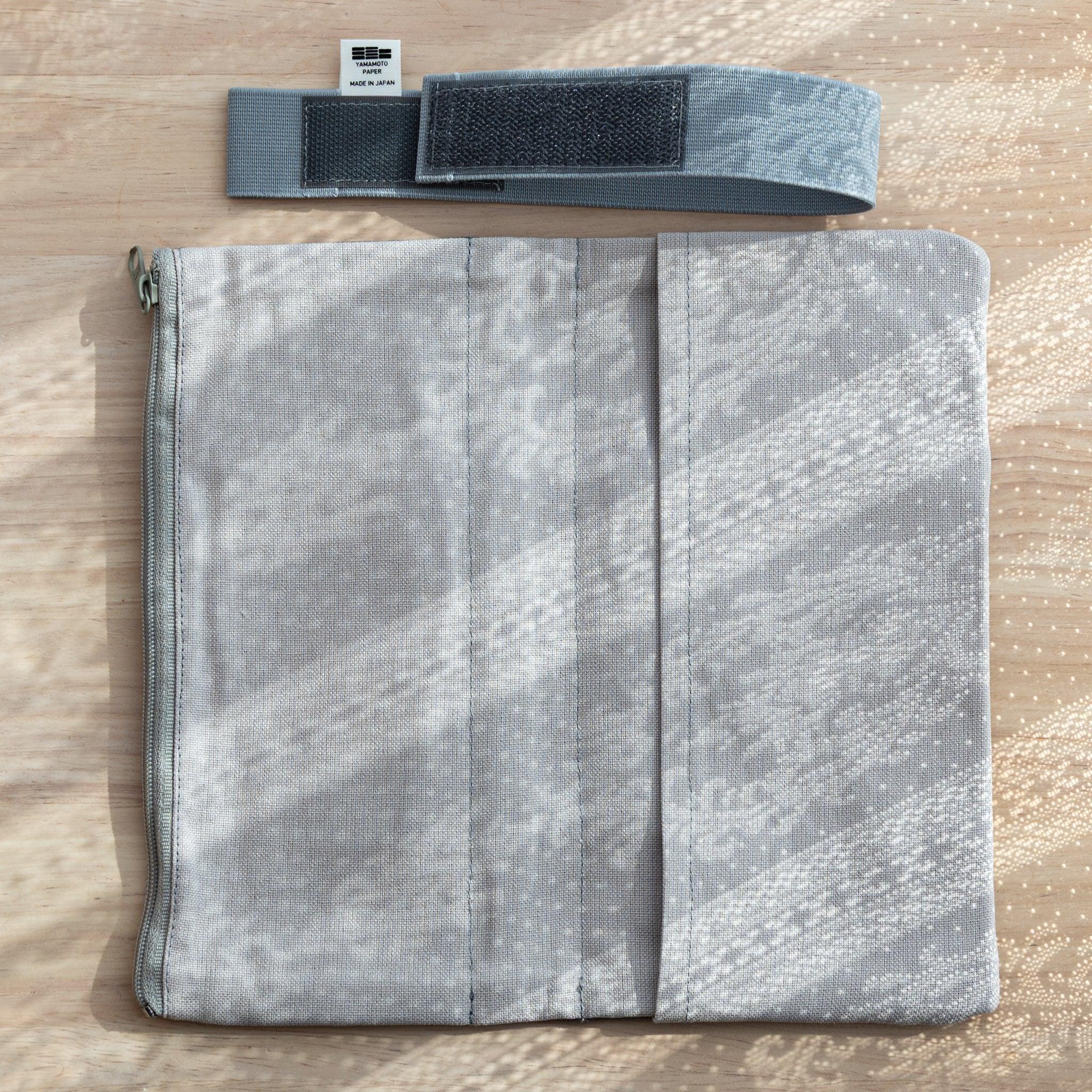 RO-BIKI Canvas Cover Cool Gray laid flat, showing detachable band for securing Japanese Note Book and pens.