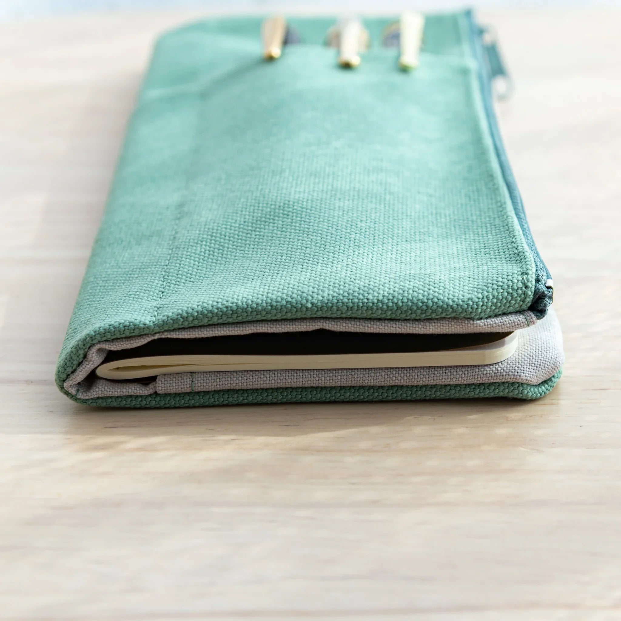 Side view of the cover with Stationery Pocket – Mint Green, neatly holding notebooks inside, Japanese Notebook Cover.