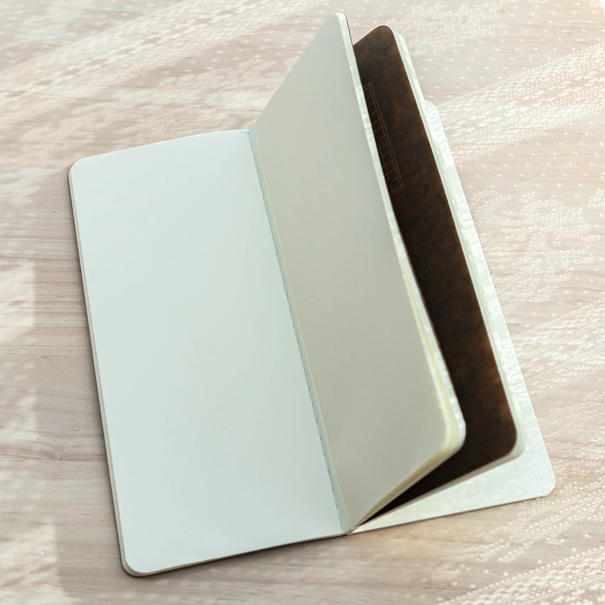 Open RO-BIKI NOTE notebook with blank inner pages, designed to fit securely inside the Japanese Note Book Cover.