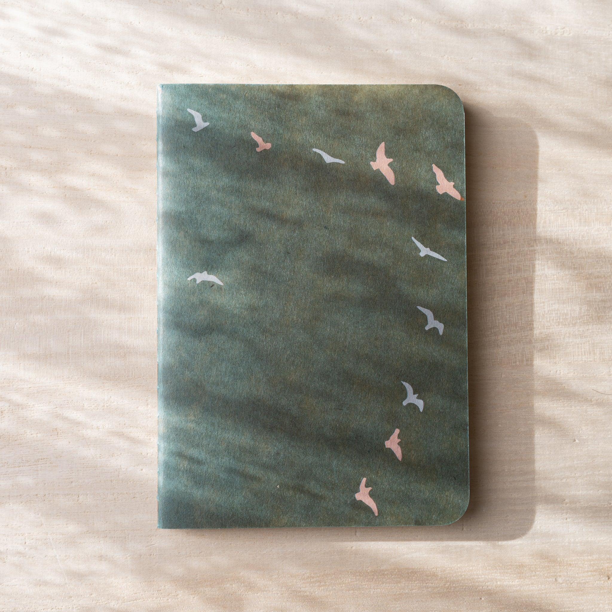 RO-BIKI NOTE Japanese notebook, full sage green waxed kraft cover with scattered flying bird silhouettes in pink and gray