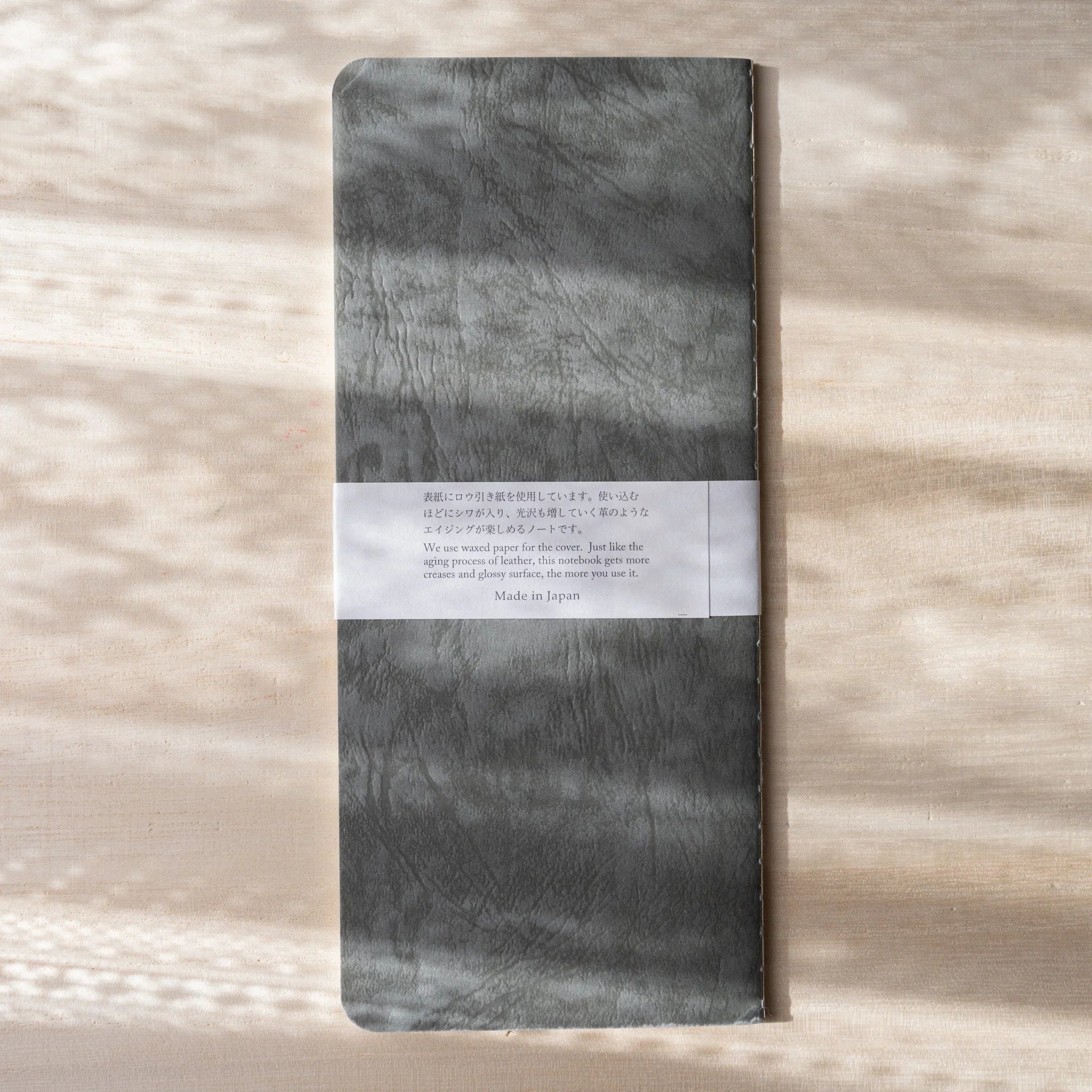 RO-BIKI NOTE Ginnezu gray notebook back with product description band label showing Made in Japan wax paper details