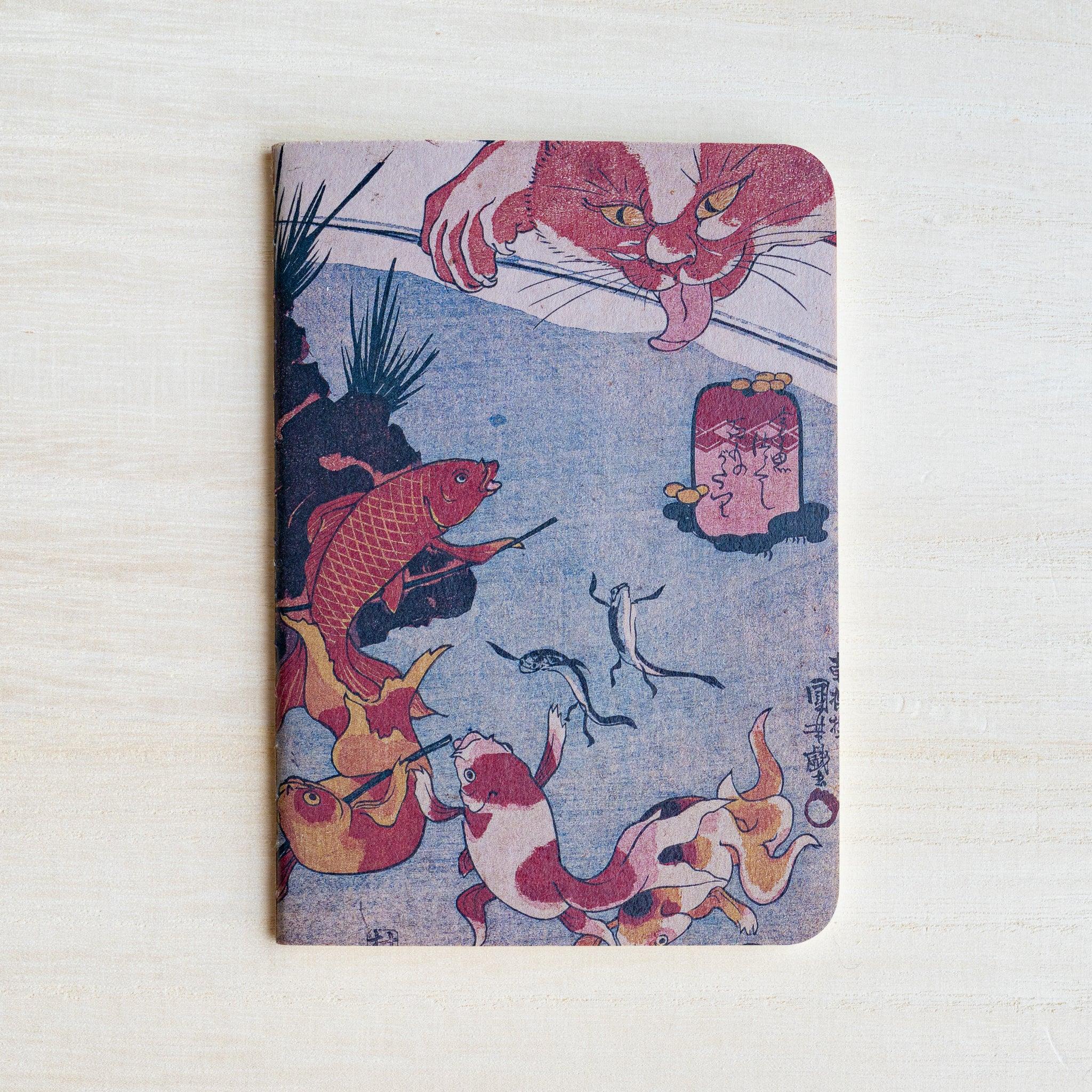 RO-BIKI Kingyo Goldfish notebook front cover without its paper band, showing a red carp and a pale cat paw