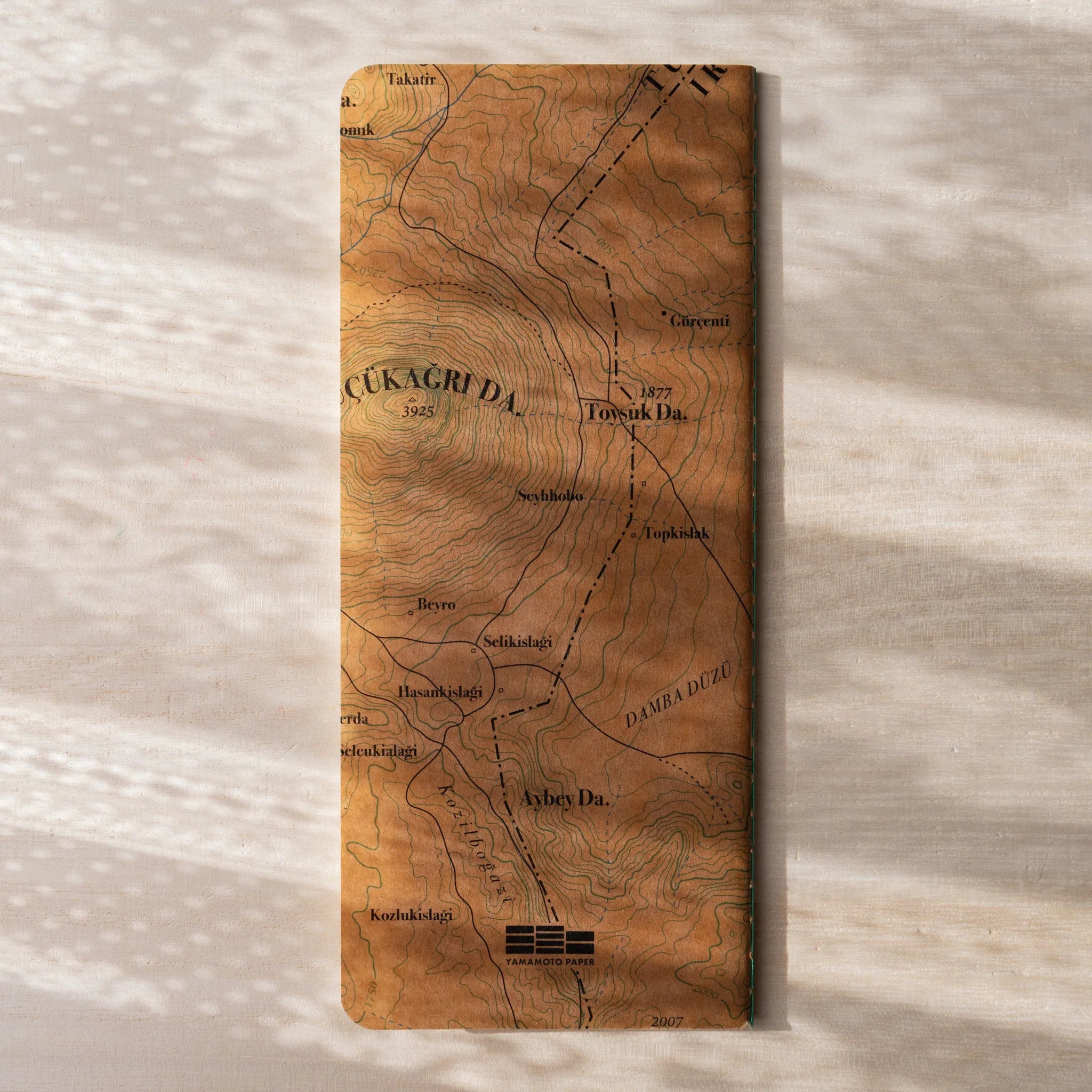 Front cover of RO-BIKI NOTE Topographical Map notebook with Yamamoto Paper logo and wax-coated vintage map print