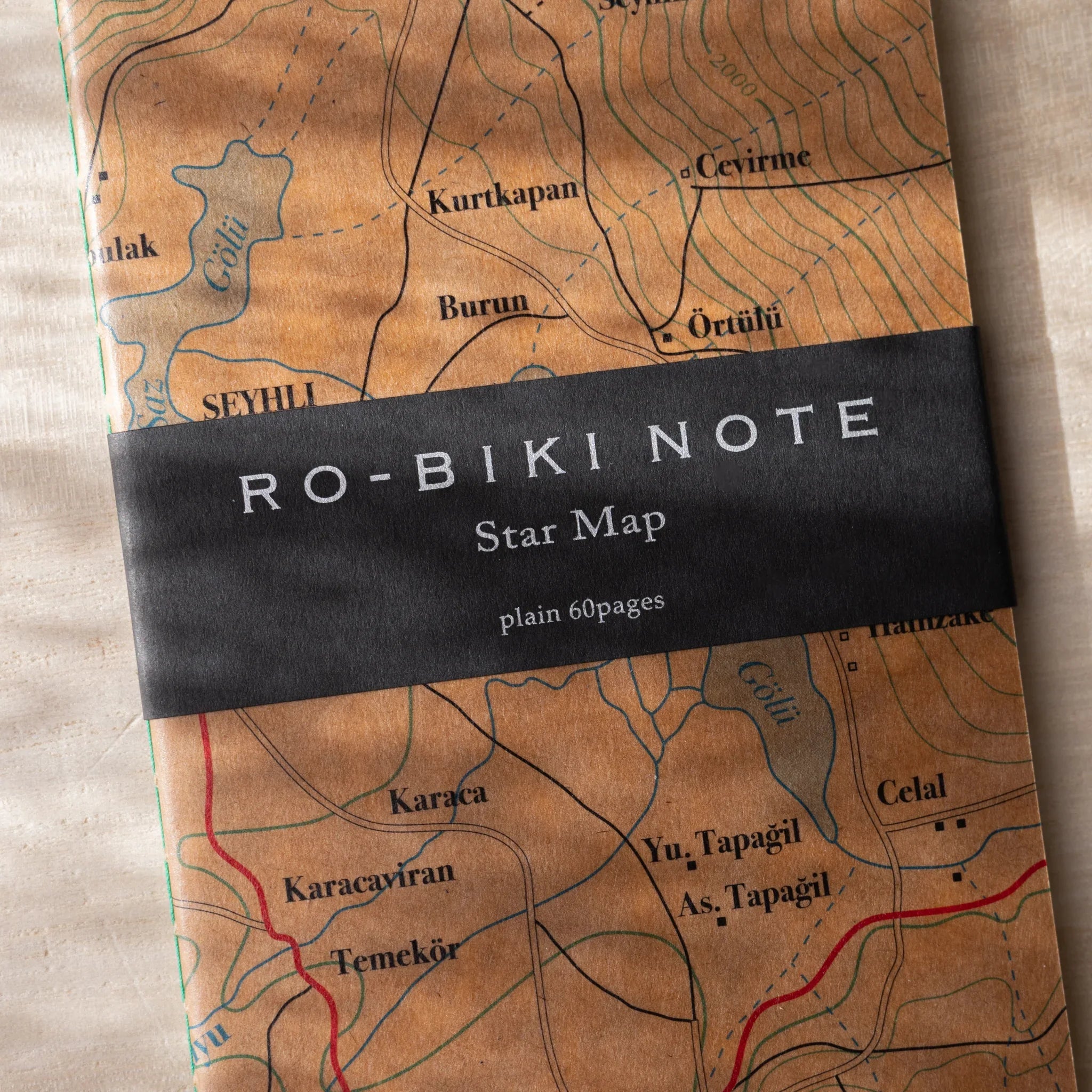 Close-up of RO-BIKI NOTE wax-coated topographical map cover with belly band label showing plain 60 pages