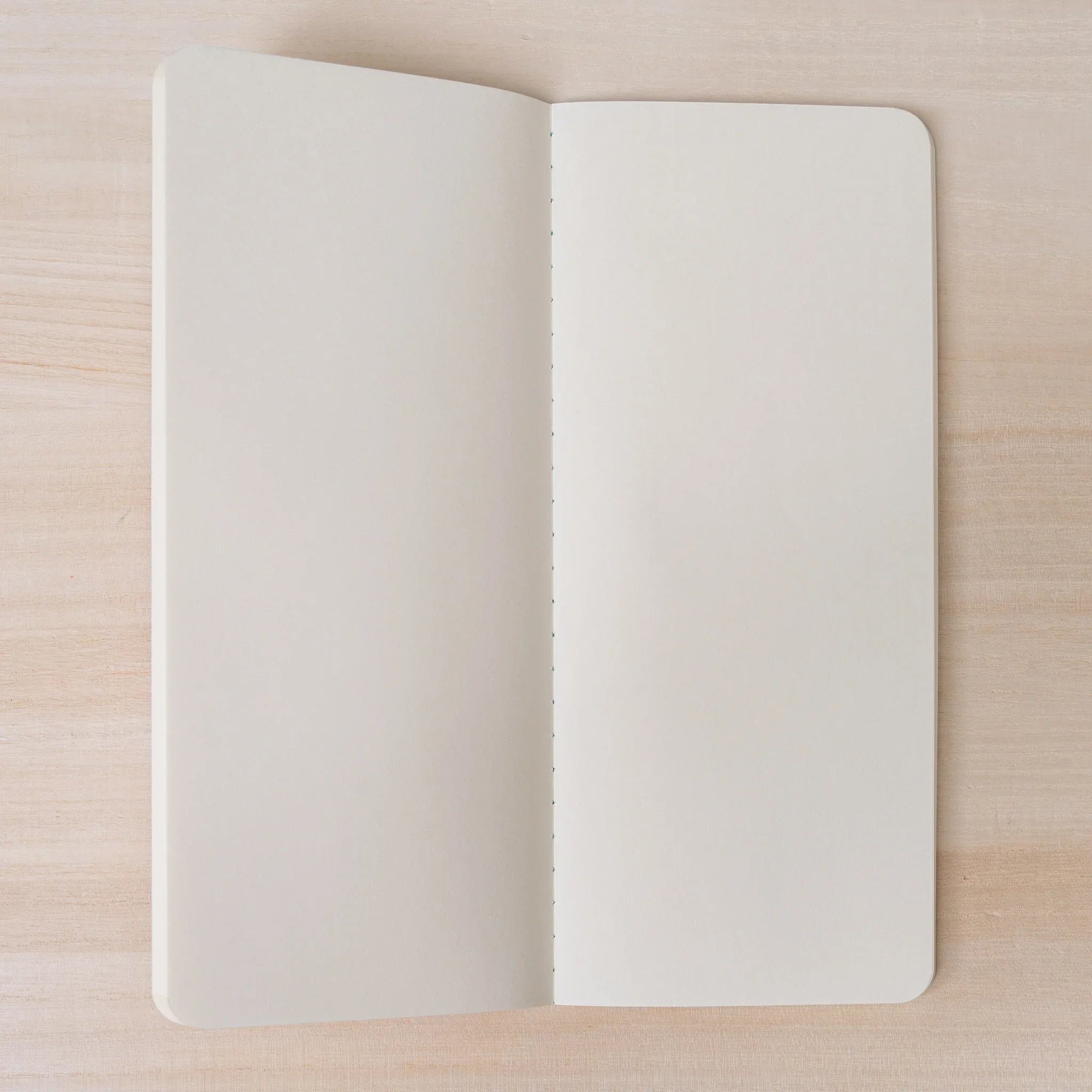 RO-BIKI NOTE Topographical Map notebook interior spread showing thread-bound spine and smooth cream pages