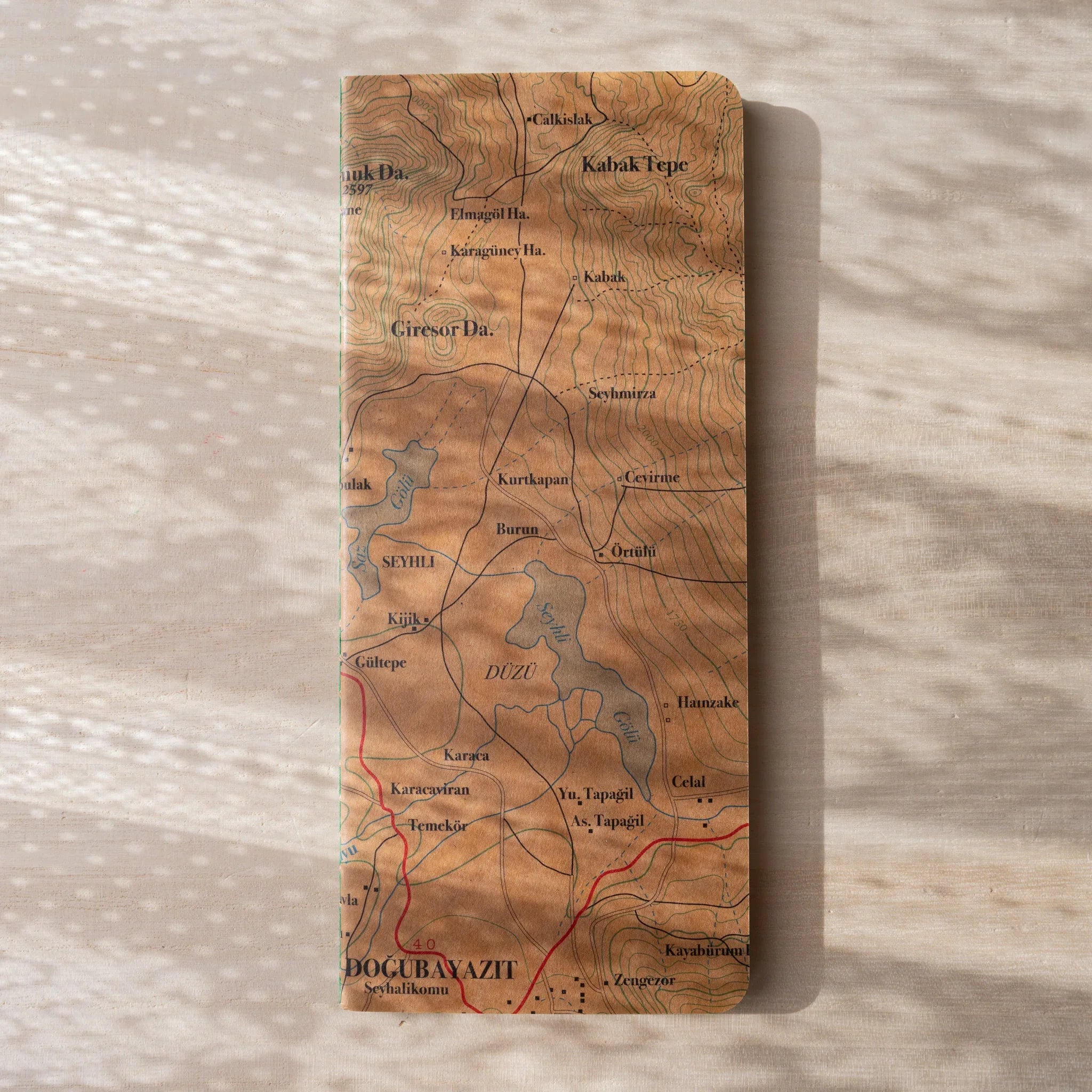 Back cover of RO-BIKI NOTE Topographical Map notebook showing detailed wax-coated contour map with place names
