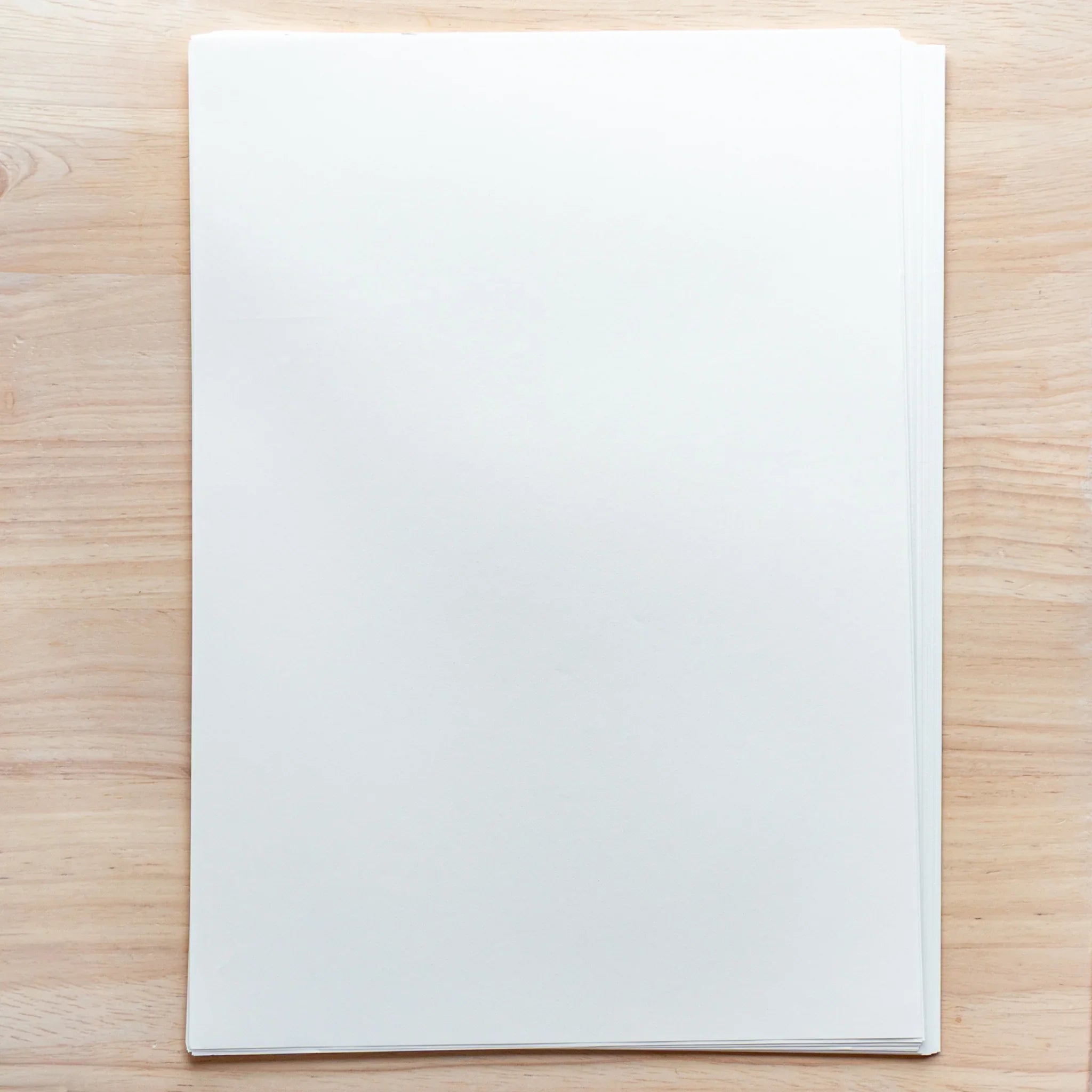 Stack of Sanzen Tomoe River Japanese Loose Leaf Paper A4, 52gsm sheets, lightweight smooth paper for fountain pen use.