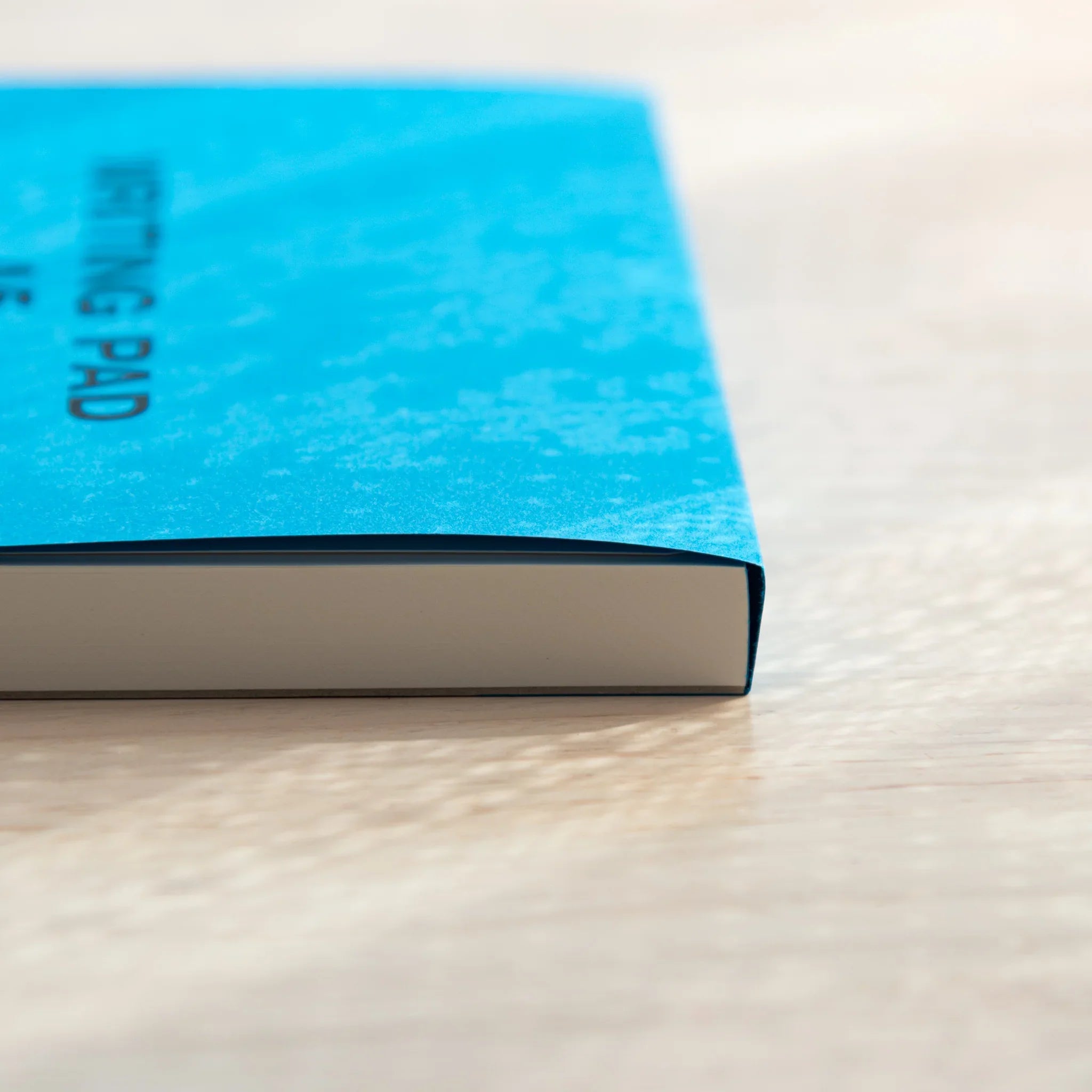 Side view of glued binding on Sanzen Tomoe River A5 Japanese Writing Pad, ensuring durability and smooth use.
