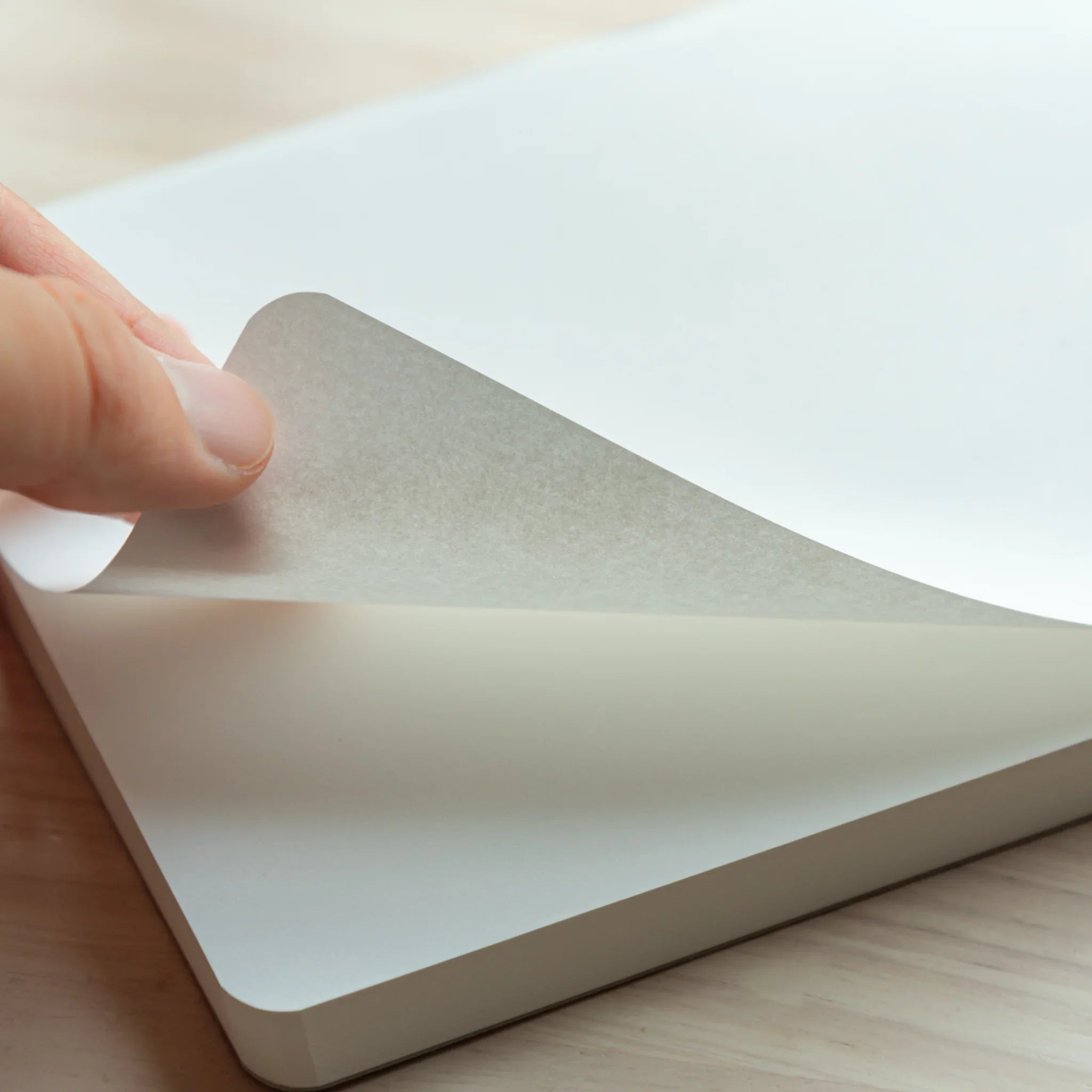 Close-up of Sanzen Tomoe River A5 Japanese Writing Pad, showing lightweight paper sheets with smooth surface.