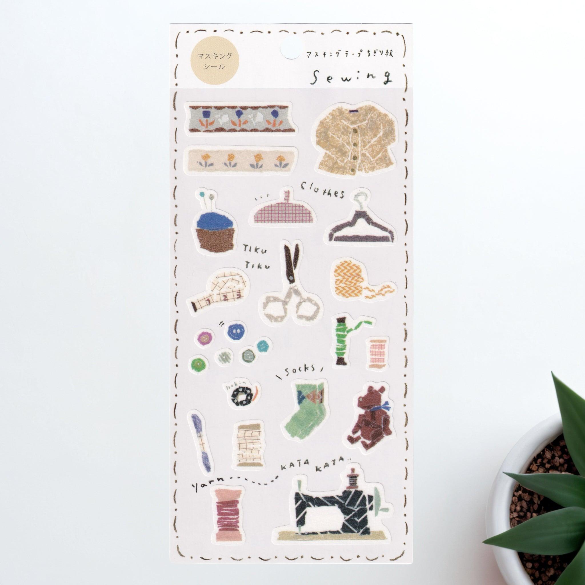 A Japanese stationery washi sticker sheet featuring sewing-themed designs, including thread spools, scissors, buttons, a sewing machine, and knitted items, in a cozy watercolor style.