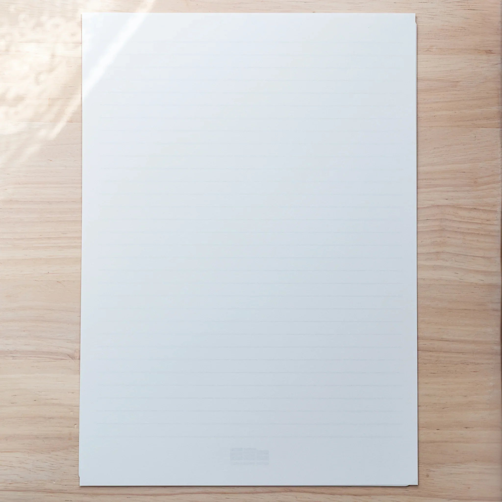 A4 Slight White Japanese Loose Leaf Paper with subtle grid underlay, perfect for pen testing and neat writing.