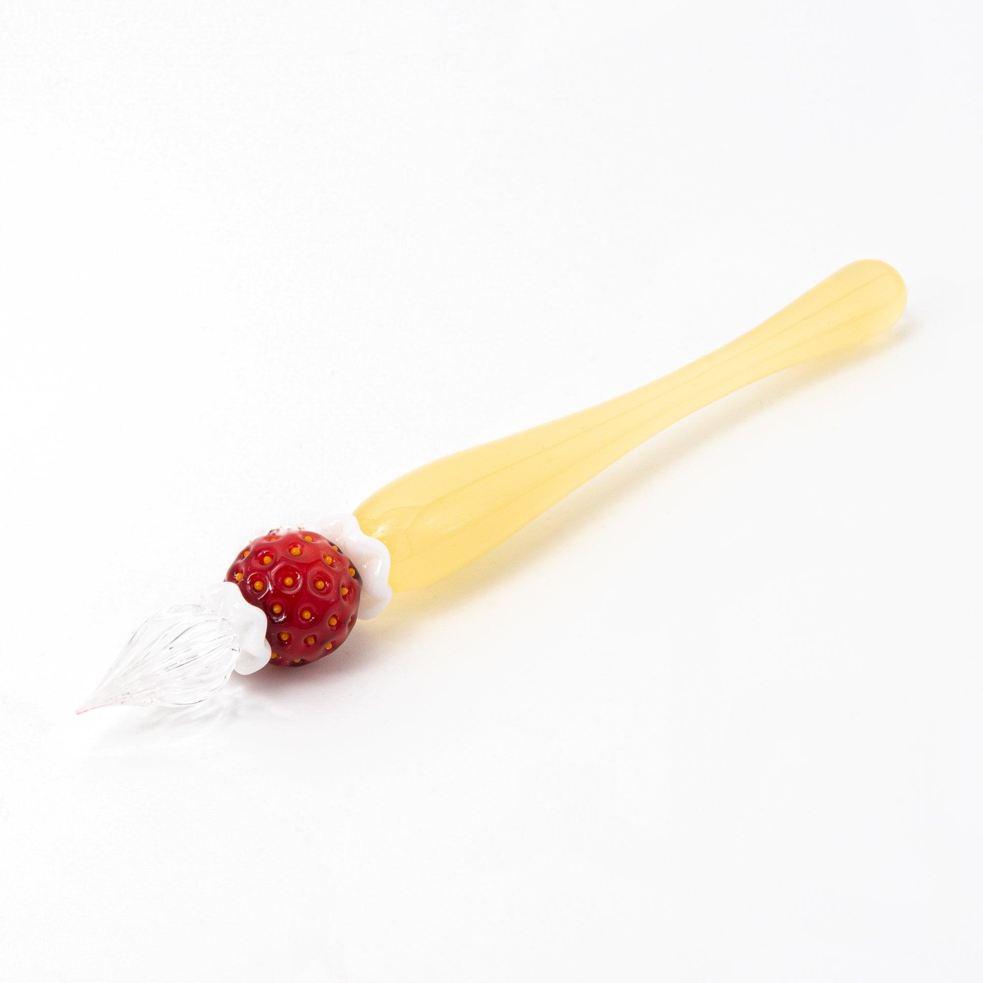 Full view of a strawberry-themed glass pen on a white background. Great for lovers of Japanese stationery.